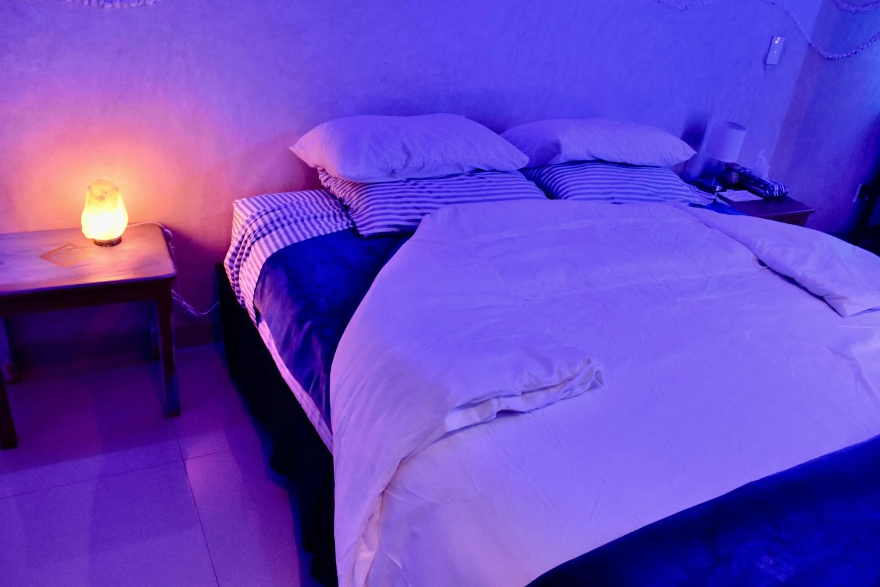 Bed in Magnolias Boutique Suites & SPA