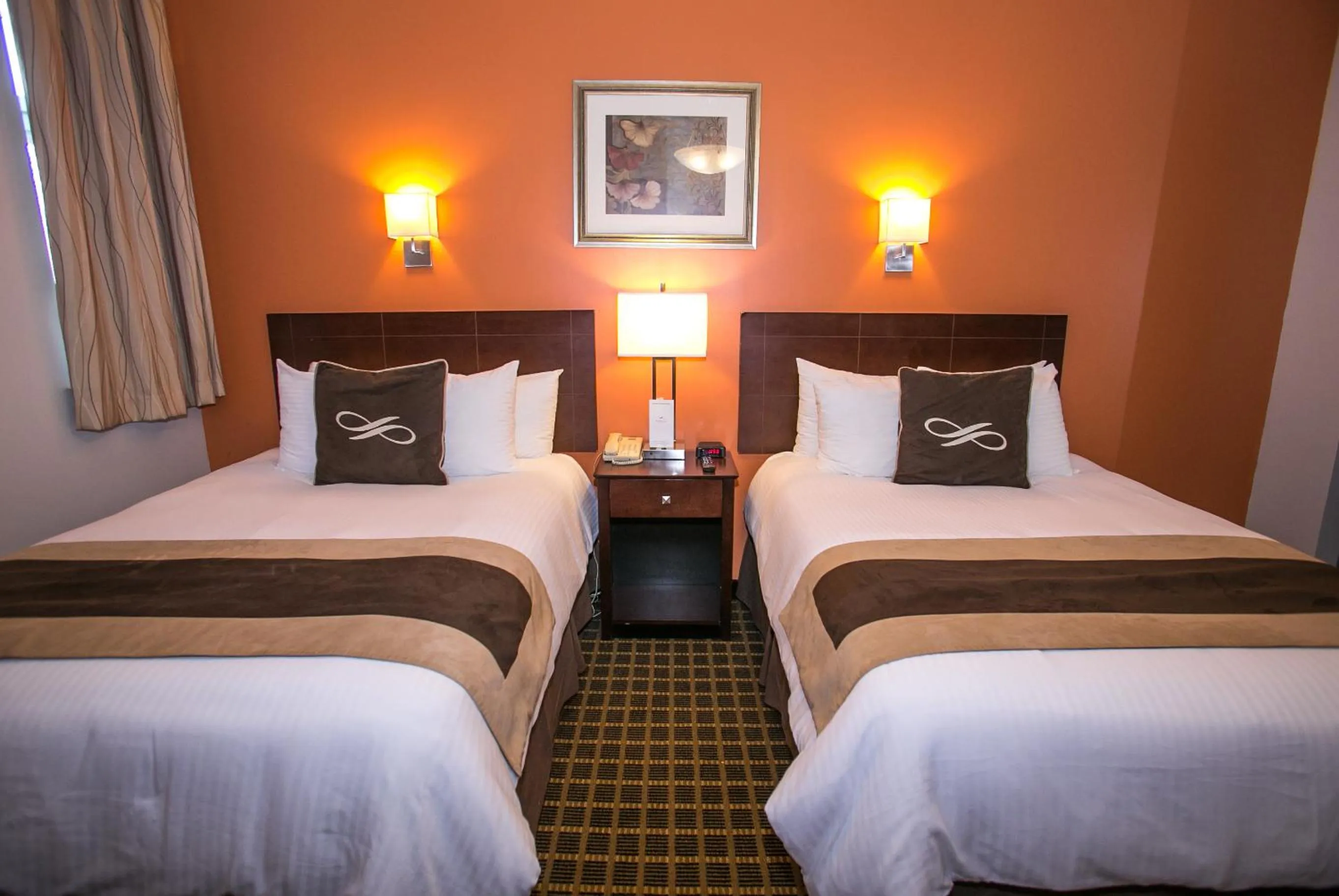 Bed in Pointe Plaza Hotel