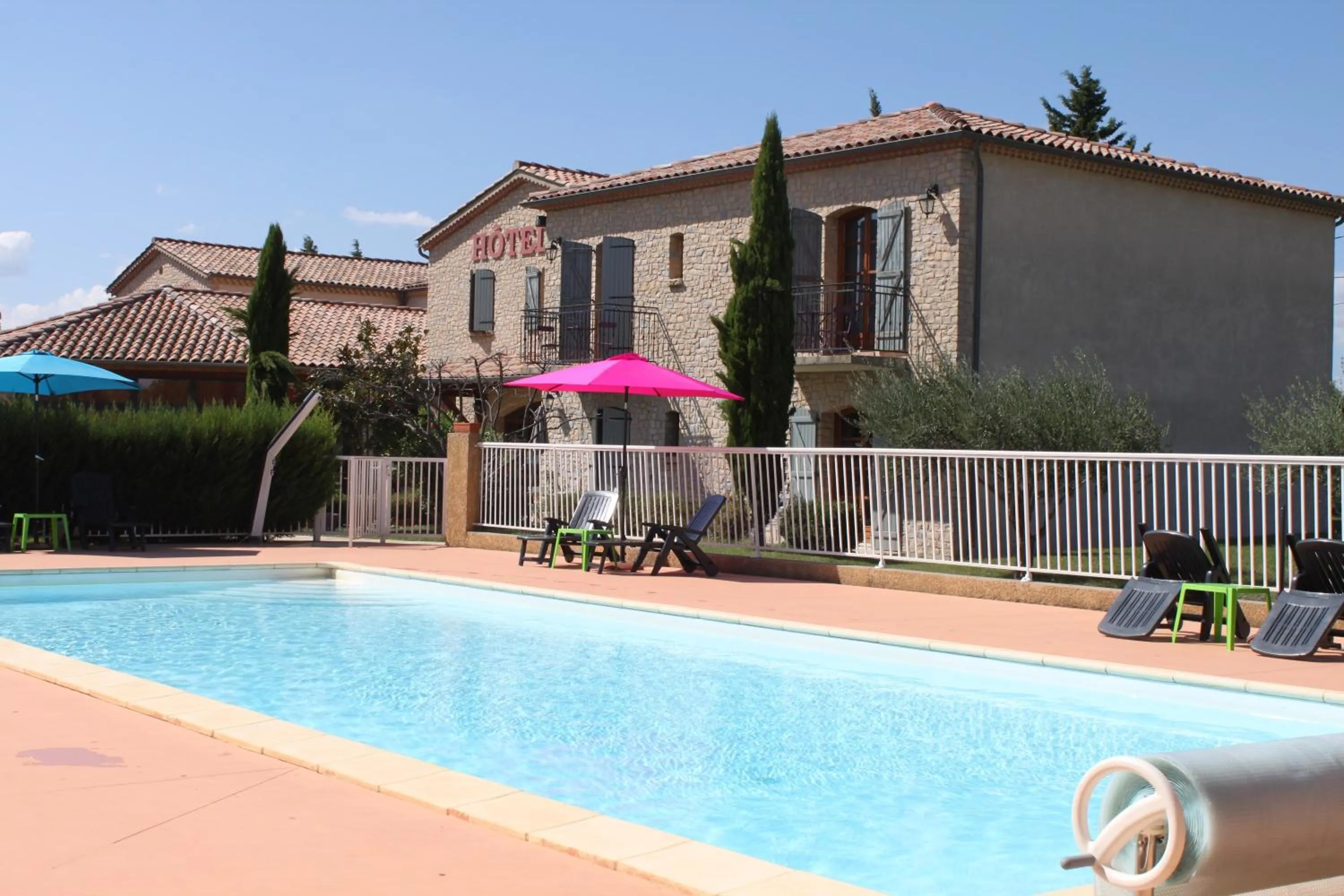 Swimming pool in Hôtel et Restaurant Logis Le Mas de Mon Père