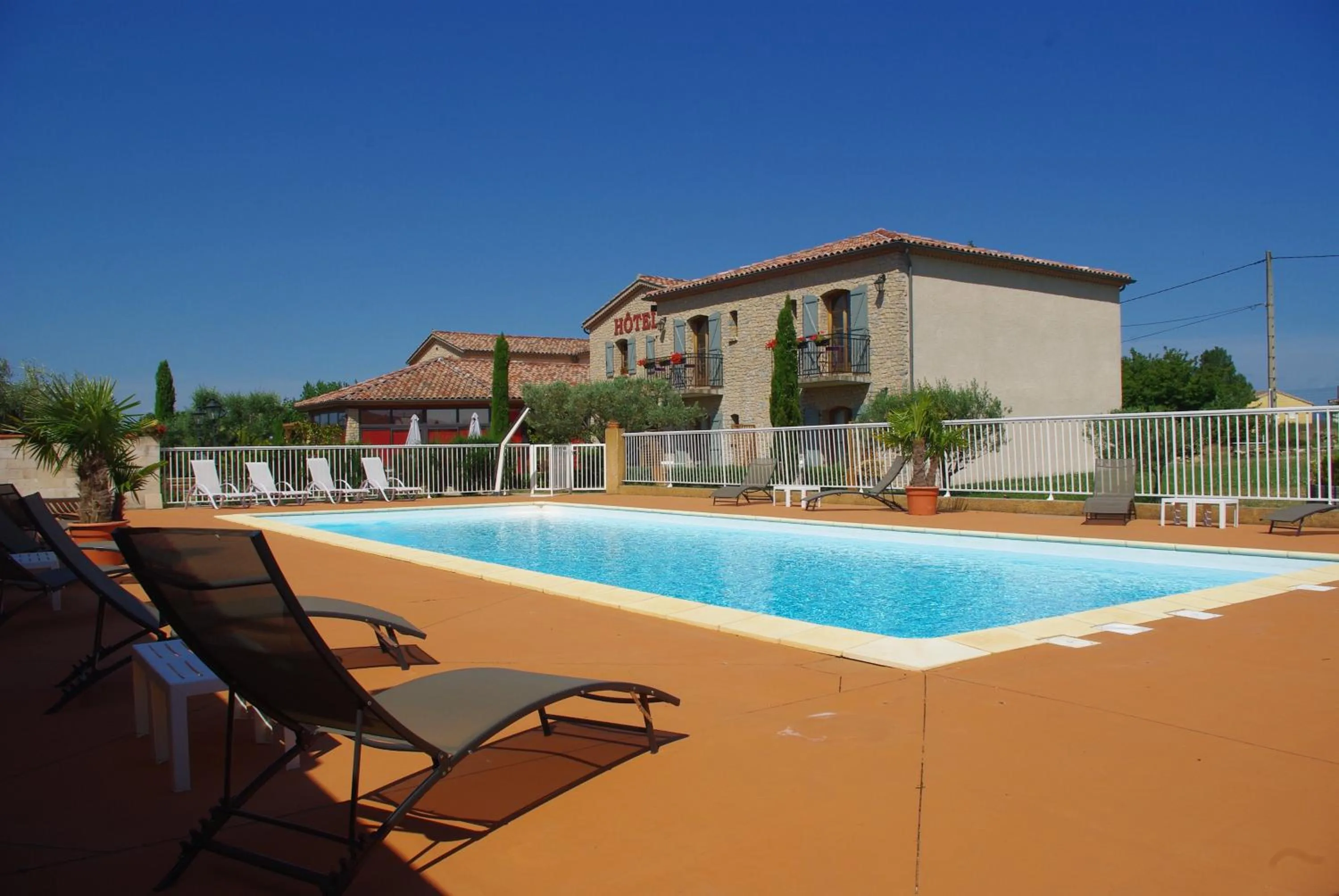 Swimming pool in Hôtel et Restaurant Logis Le Mas de Mon Père