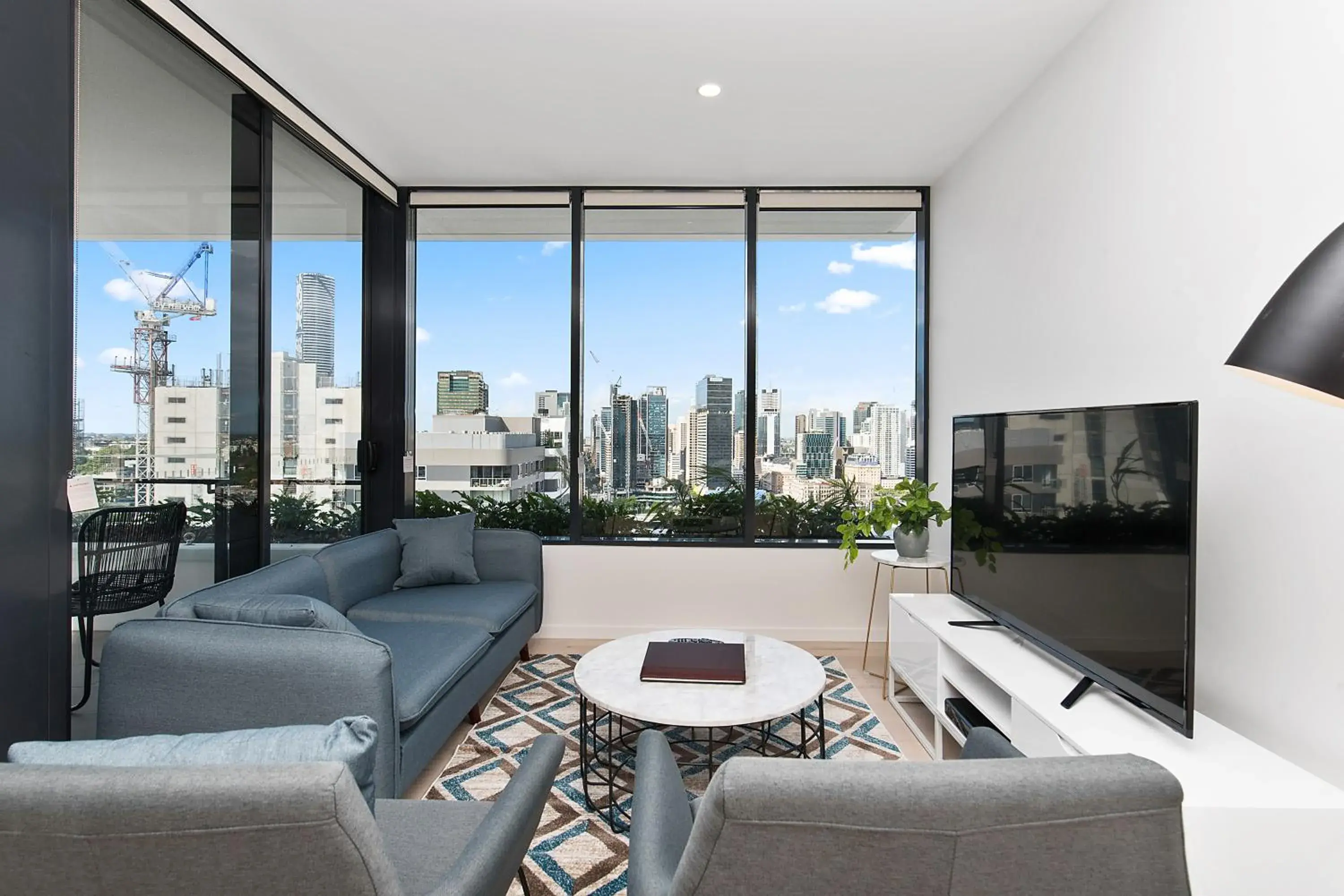 Living room in Ivy and Eve Apartments by CLLIX Living room in Ivy and Eve Apartments by CLLIX