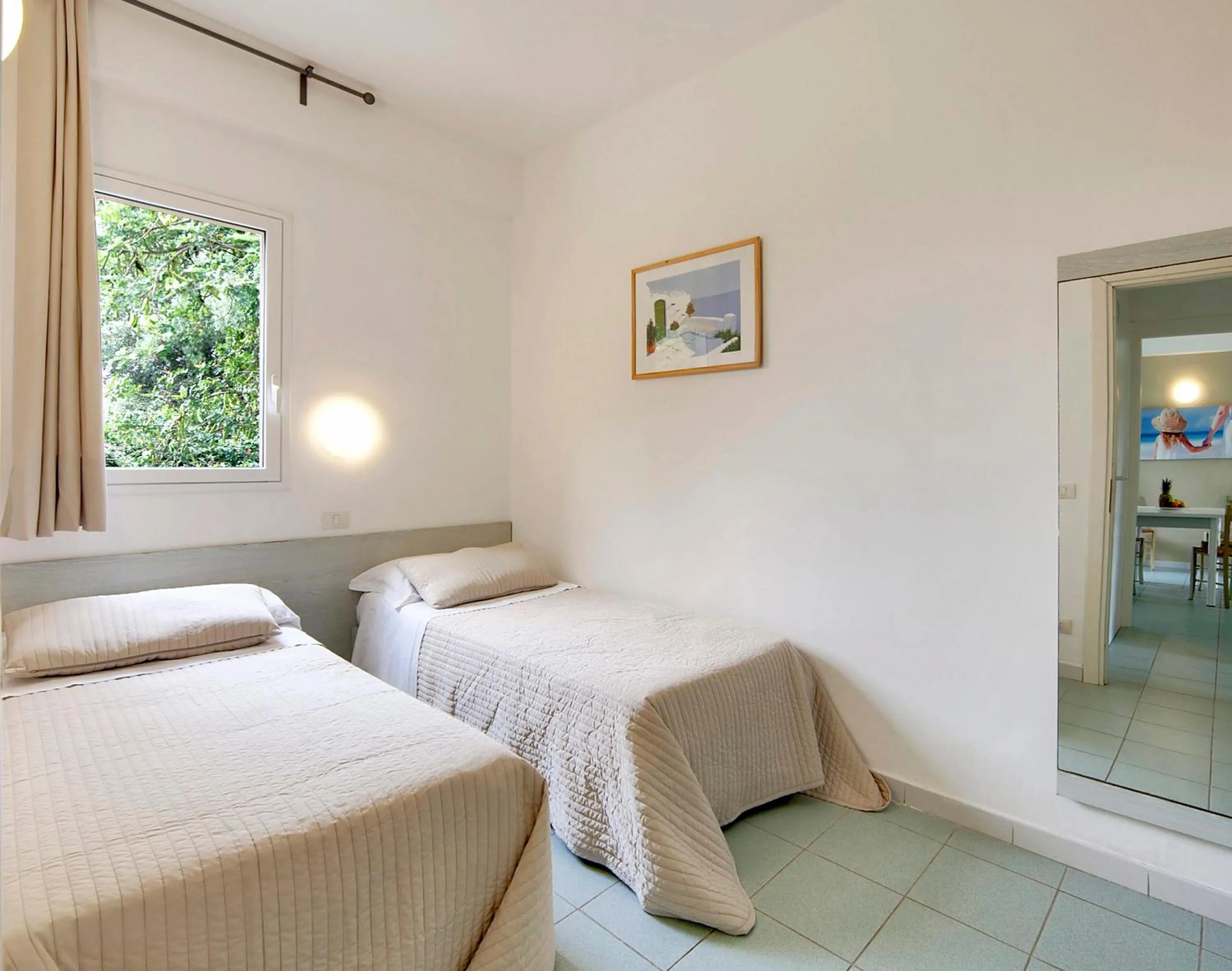 Bed in I Giardini di Athena- Athena Resort