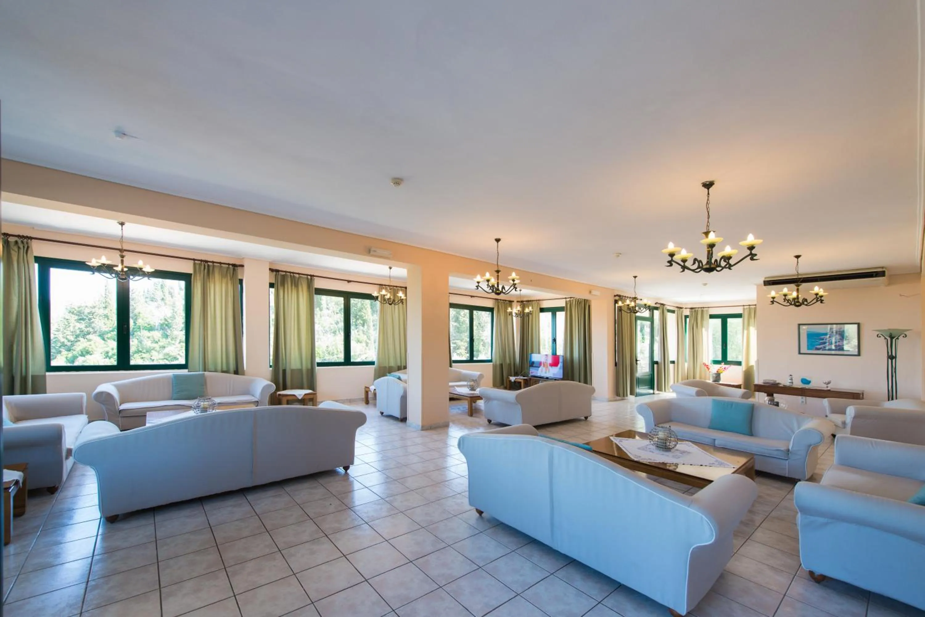 Communal lounge/ TV room in Santa Marina Hotel