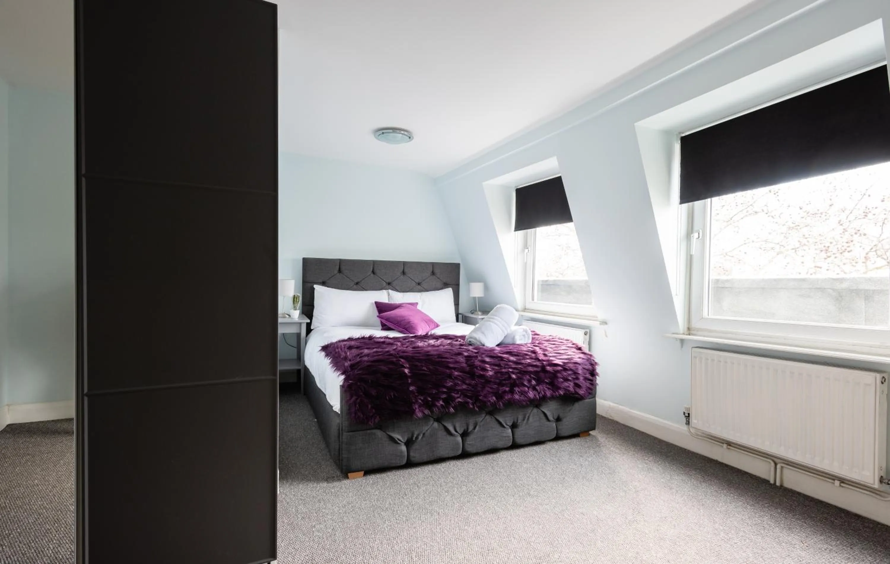 Bed in The Love Walk Apartments