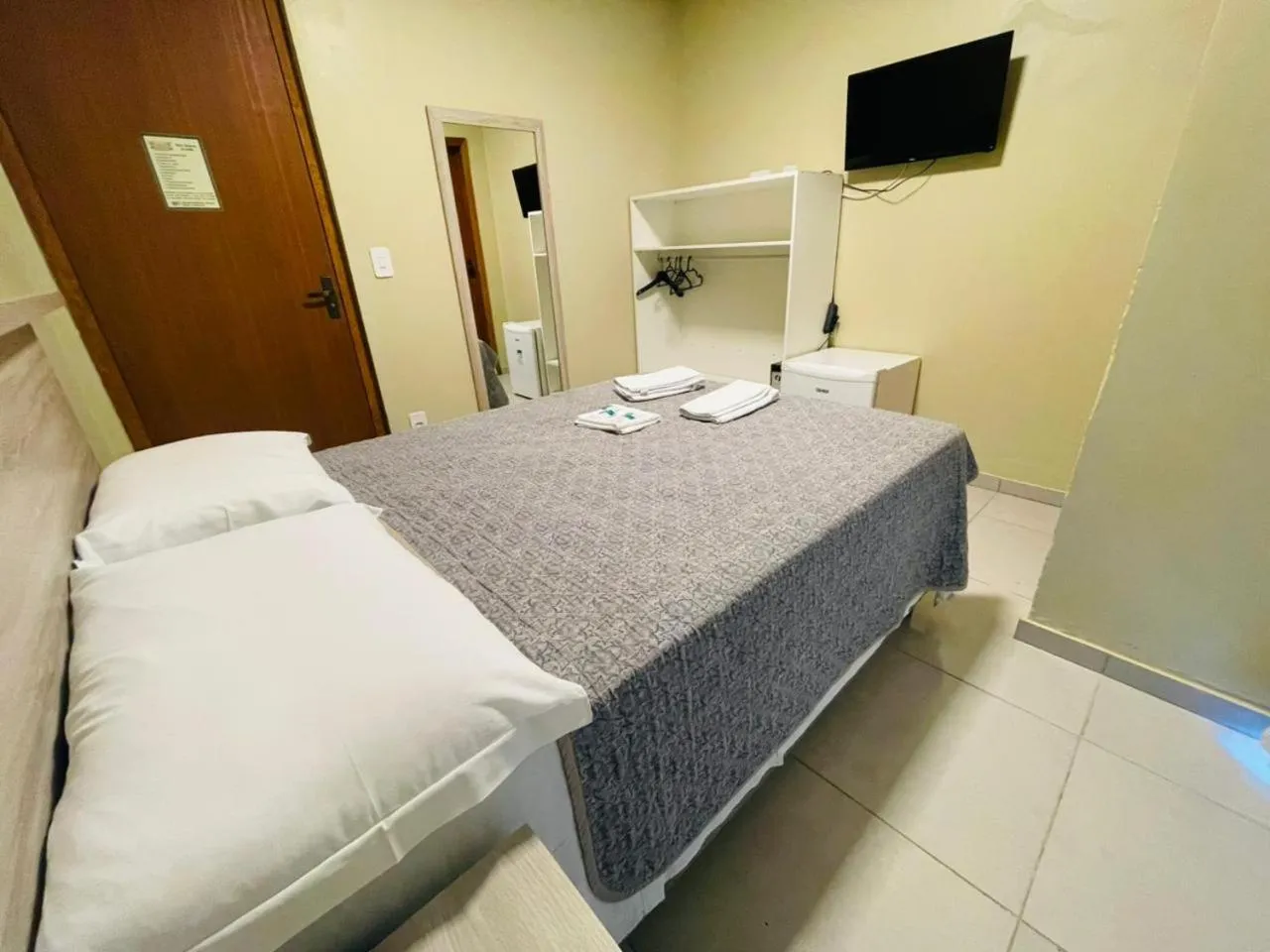 Bed in Pousada Tissiano