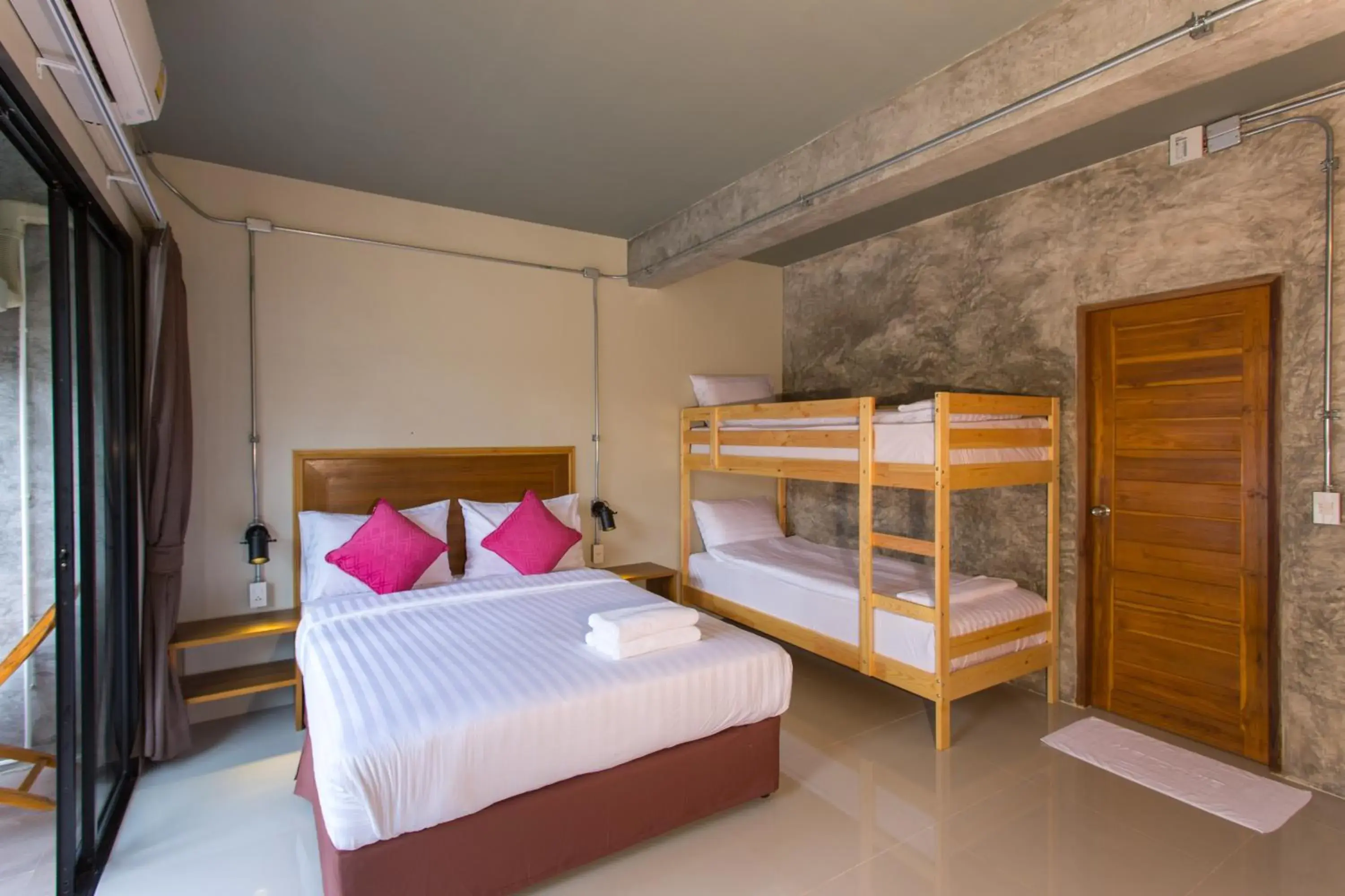 Bed in Light Khao Lak Resort Bed in Light Khao Lak Resort