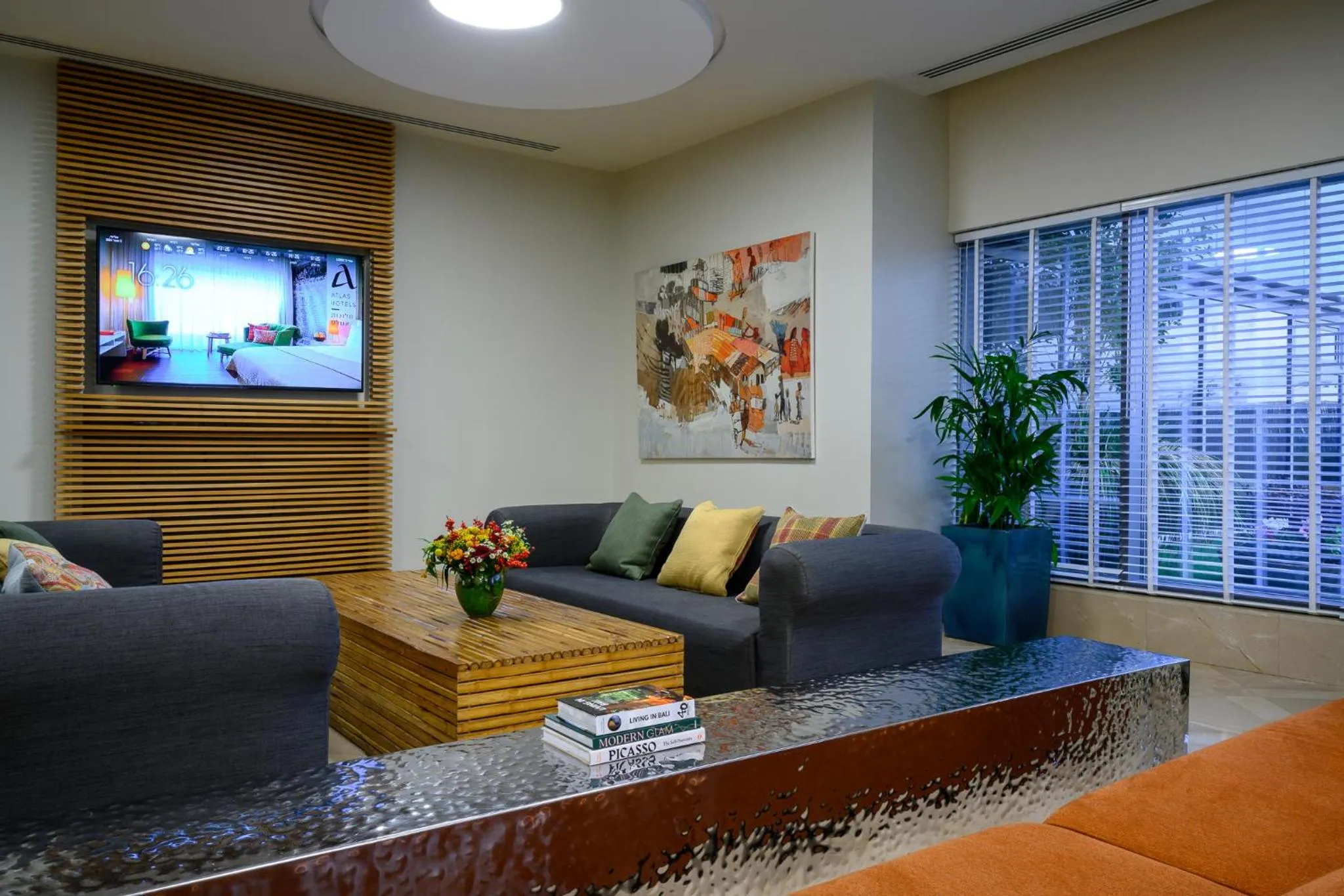 Communal lounge/ TV room in Sadot Hotel Ben Gurion Airport - an Atlas Boutique Hotel