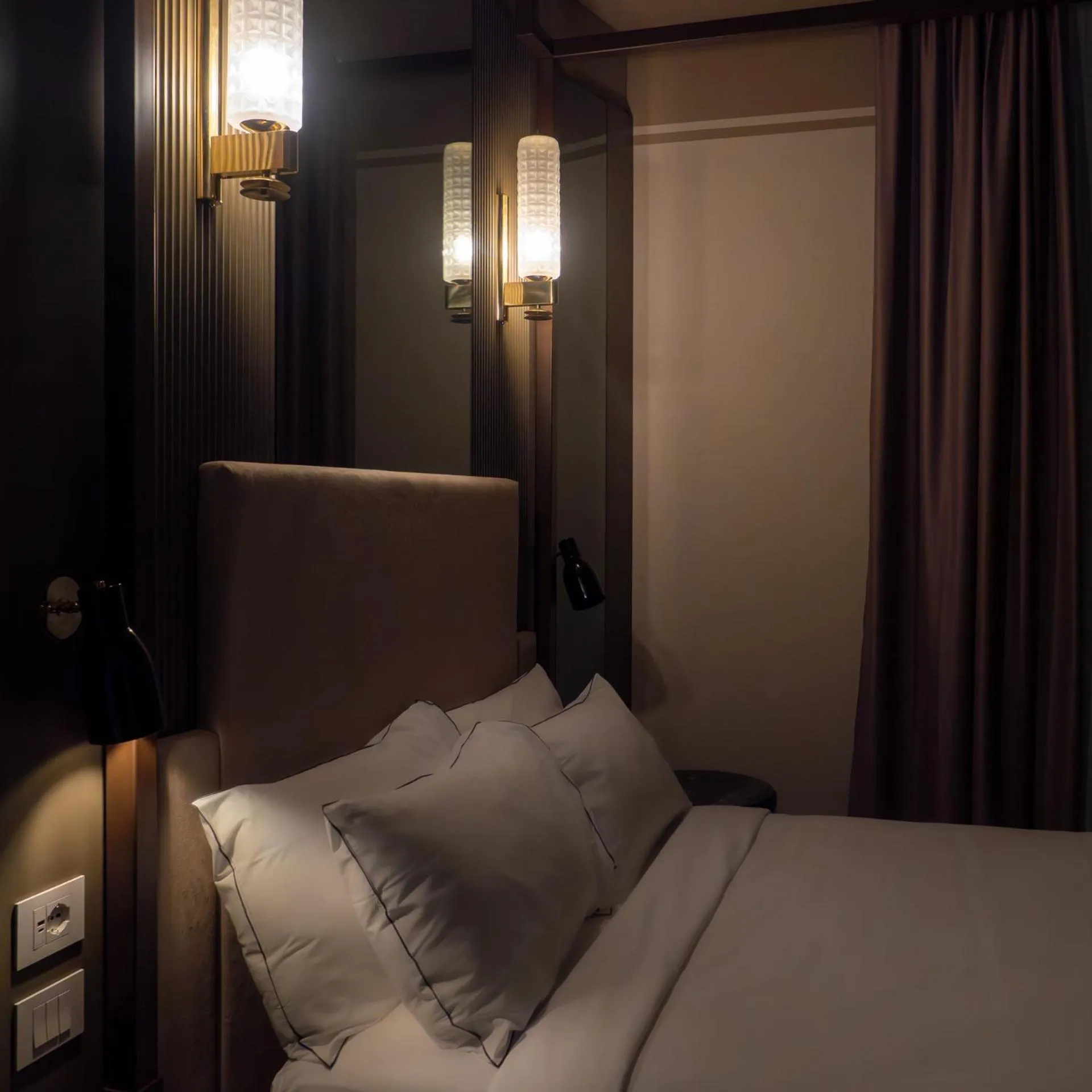 Bed in The Glam Boutique Hotel & Apt