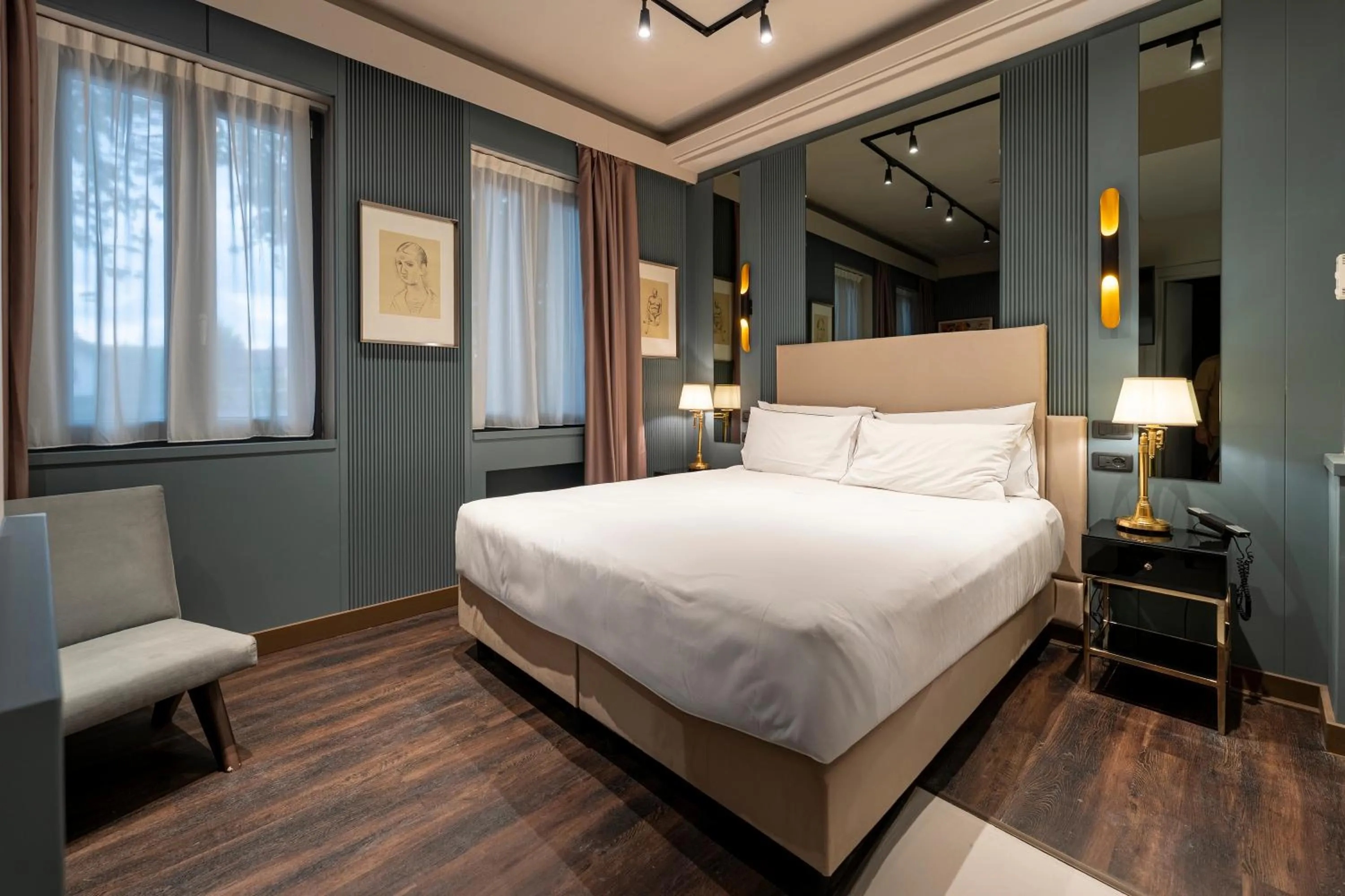 Bed in The Glam Boutique Hotel & Apt