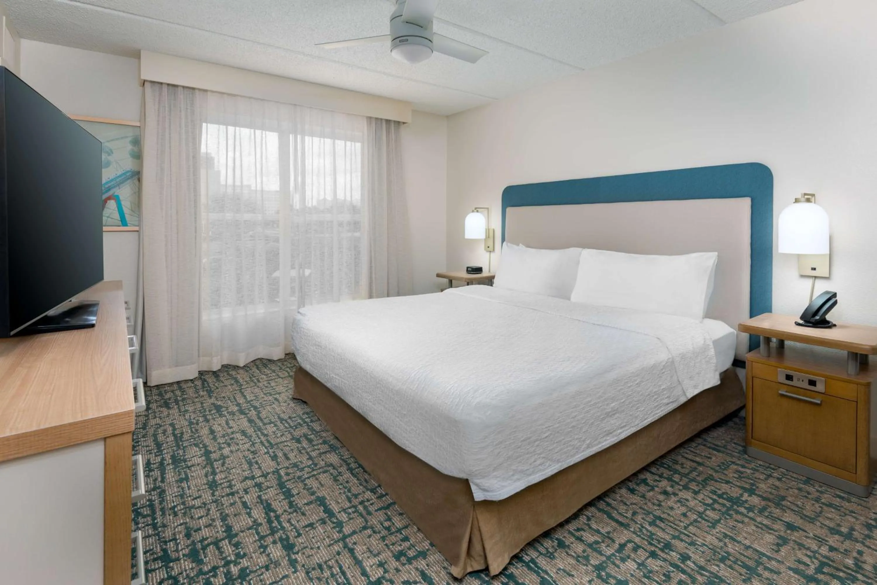 Bed in Homewood Suites by Hilton Orlando-Nearest to Universal Studios