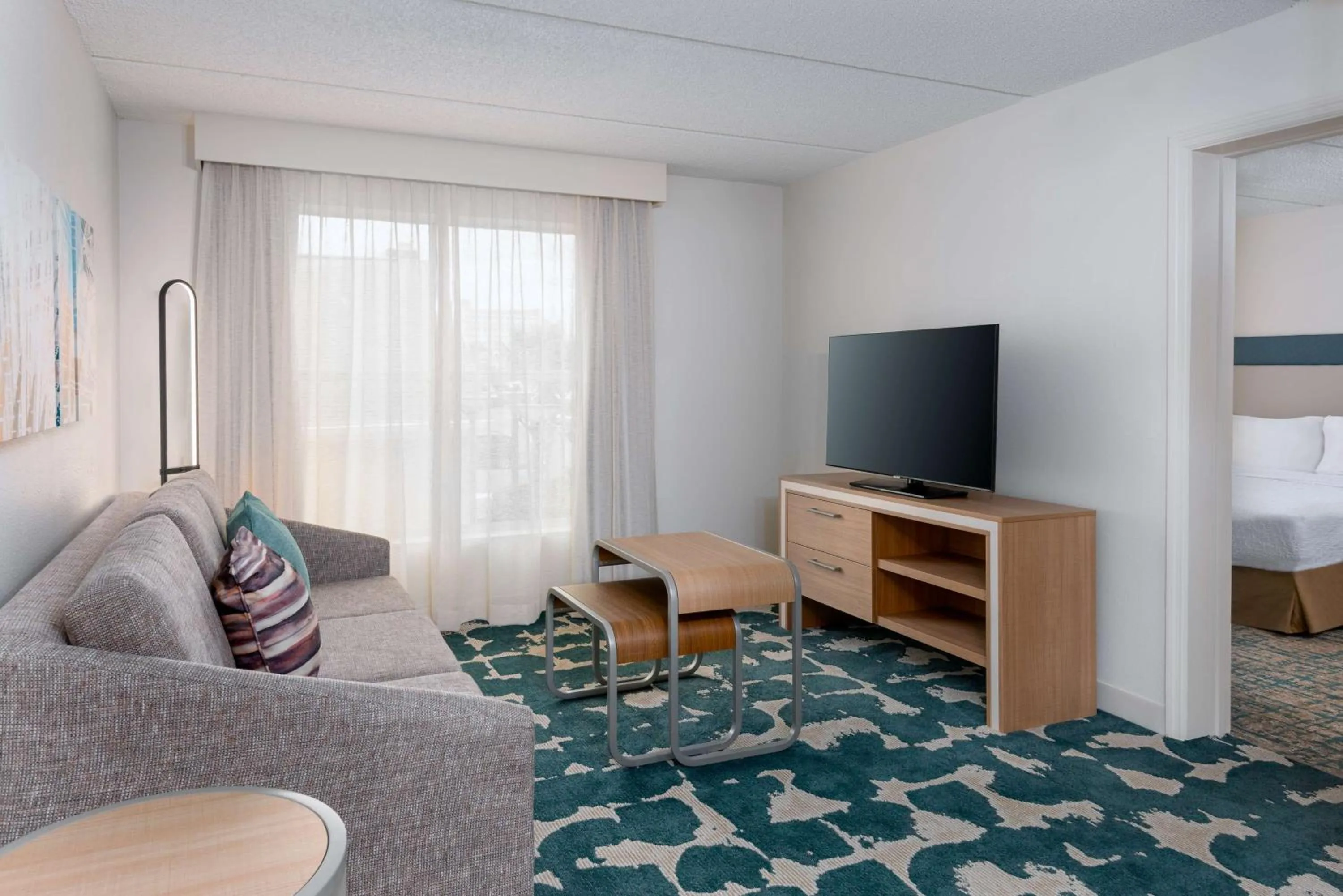 Living room, Bed in Homewood Suites by Hilton Orlando-Nearest to Universal Studios