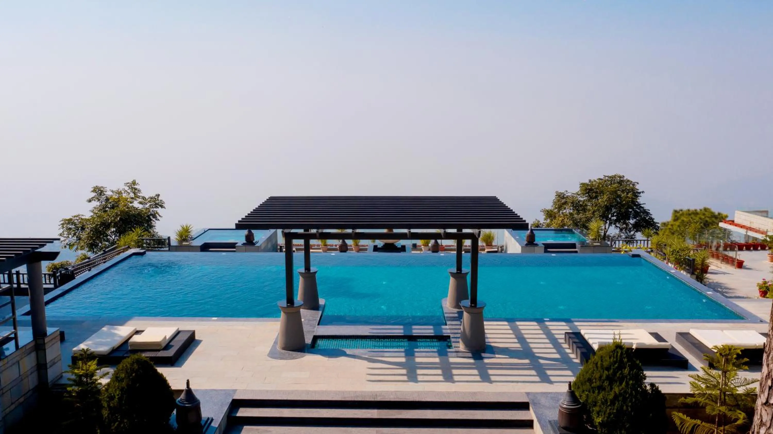 Swimming pool in Moksha Himalaya Spa Resort