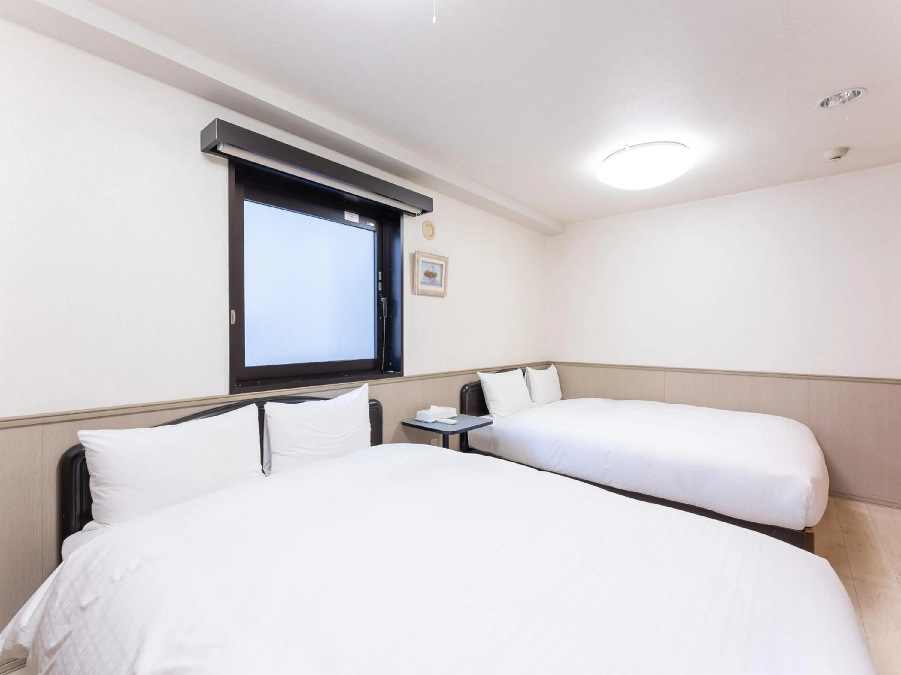 Bed in Chang Tee Hotel Ikebukuro