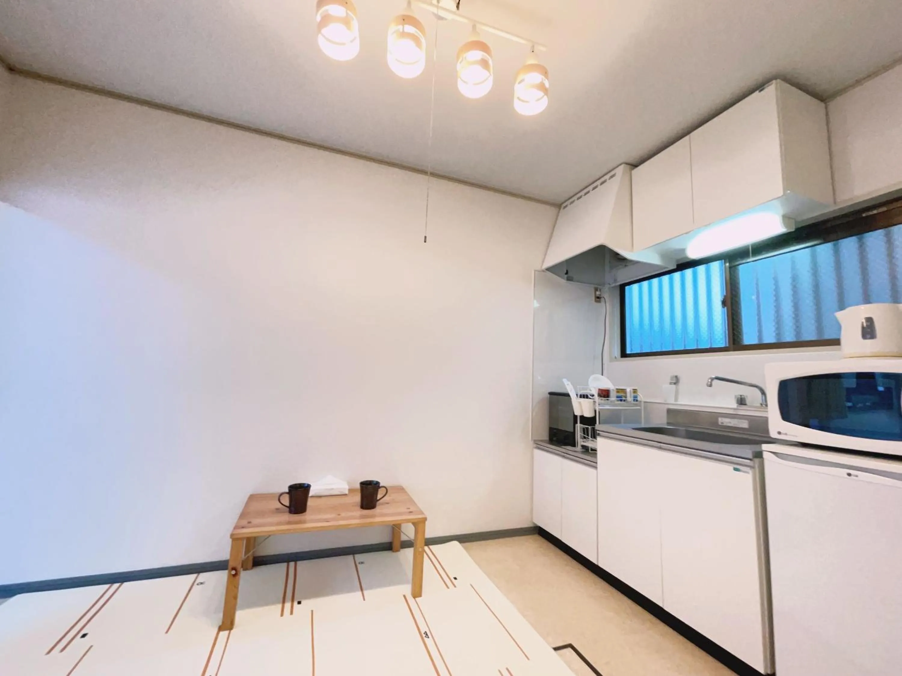 Kitchen or kitchenette in Chang Tee Hotel Ikebukuro