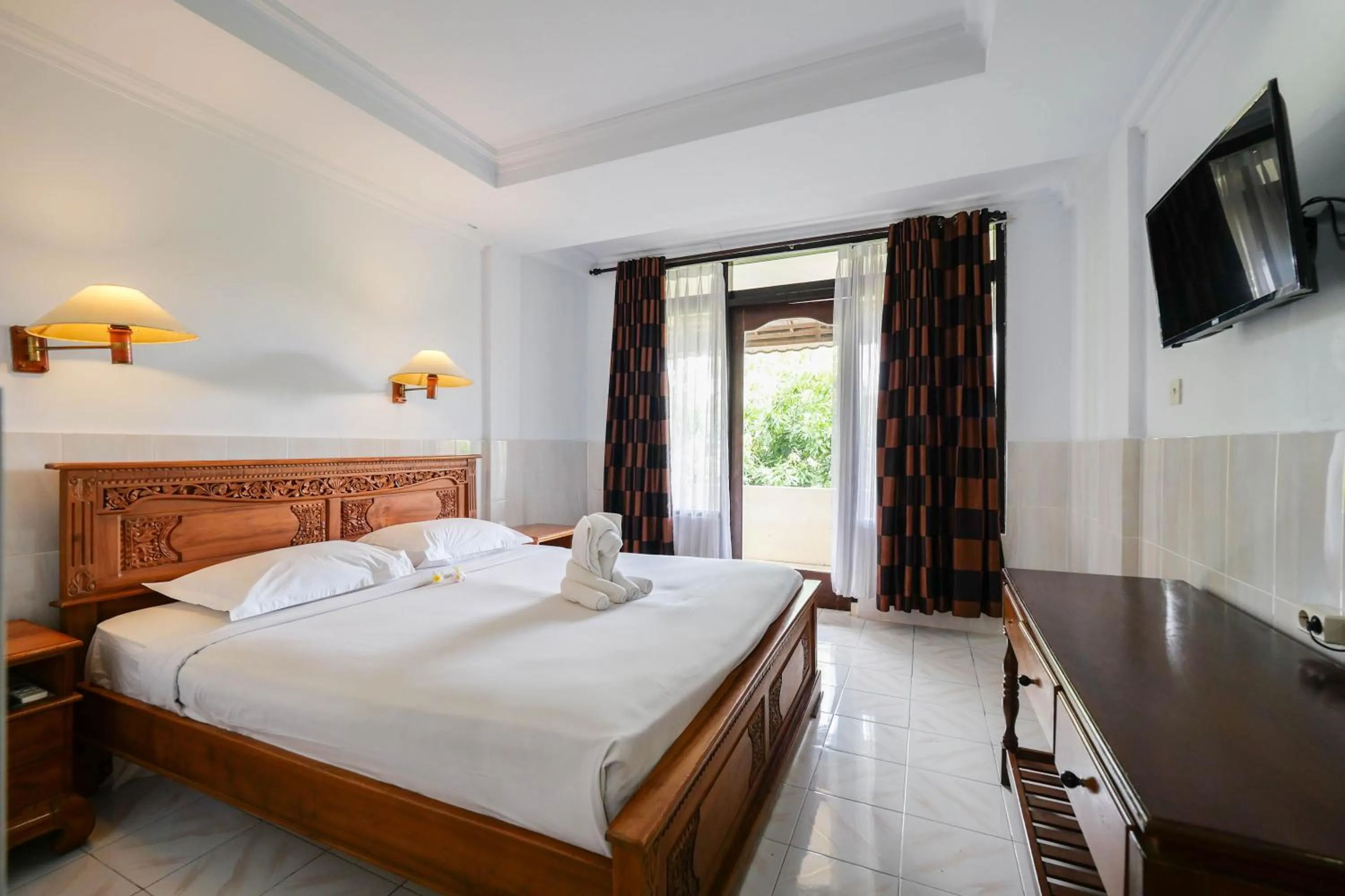 Bed in Palm Beach Hotel Bali