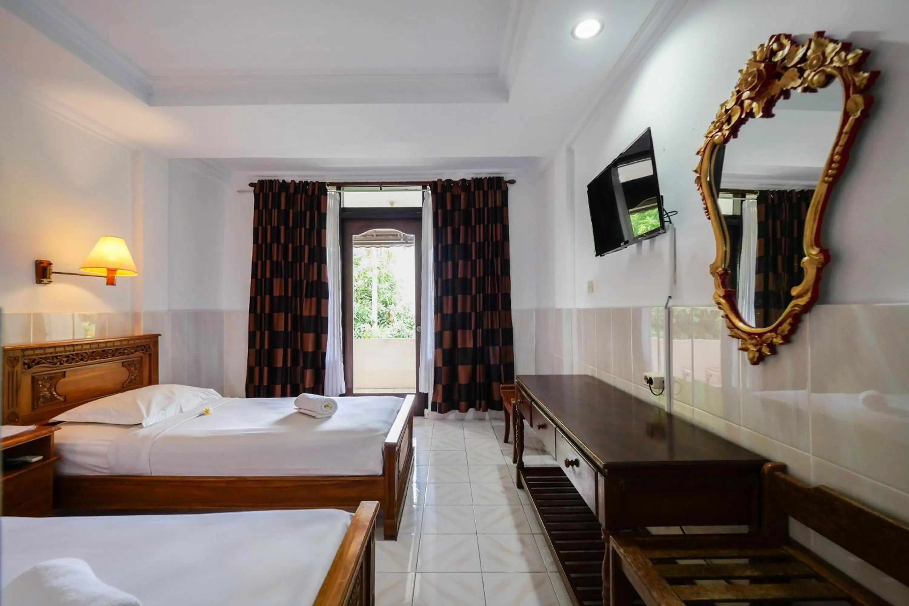 Bed in Palm Beach Hotel Bali