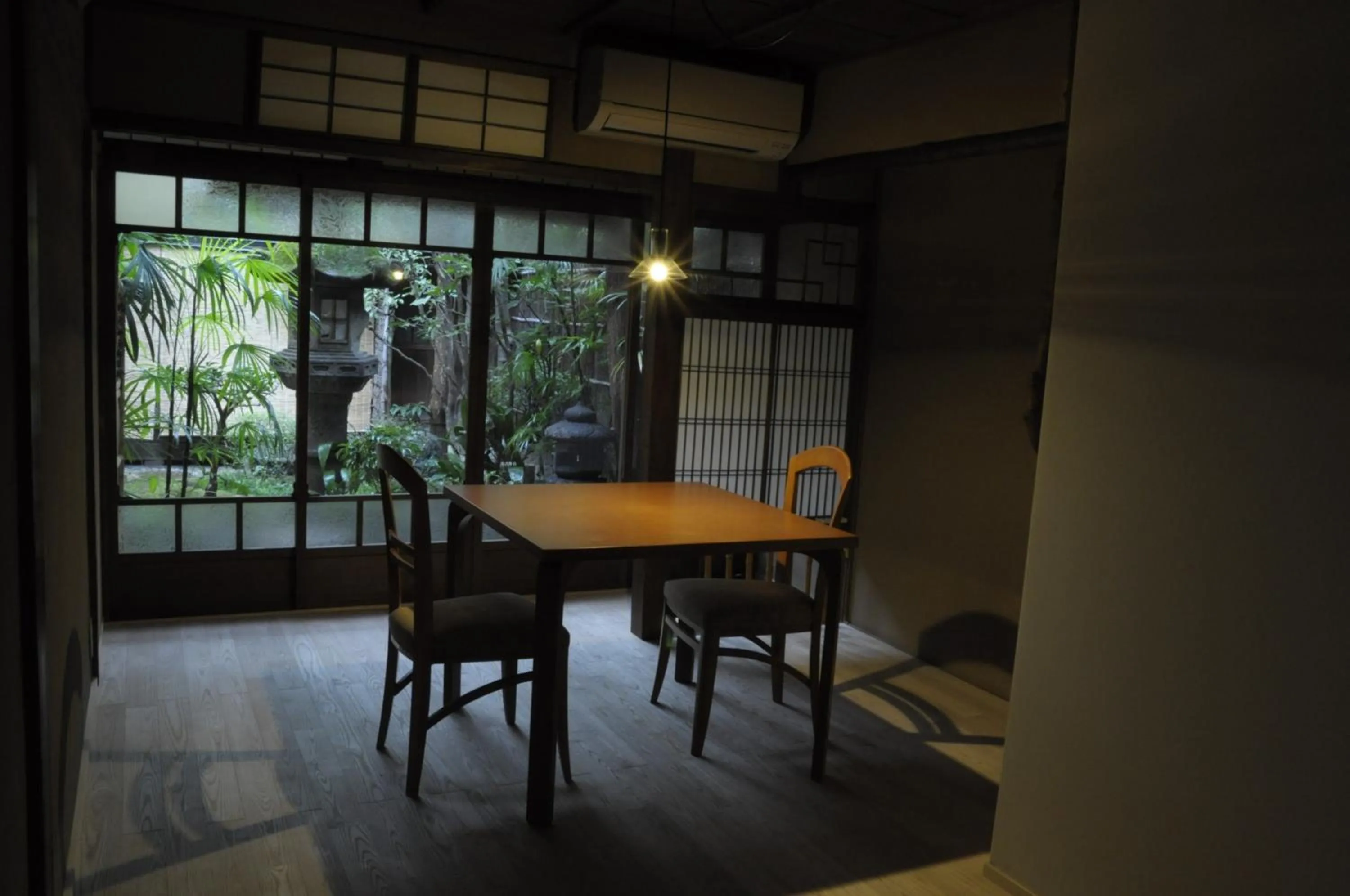Dining area in IZUYASU Traditional Kyoto Inn serving Kyoto cuisine