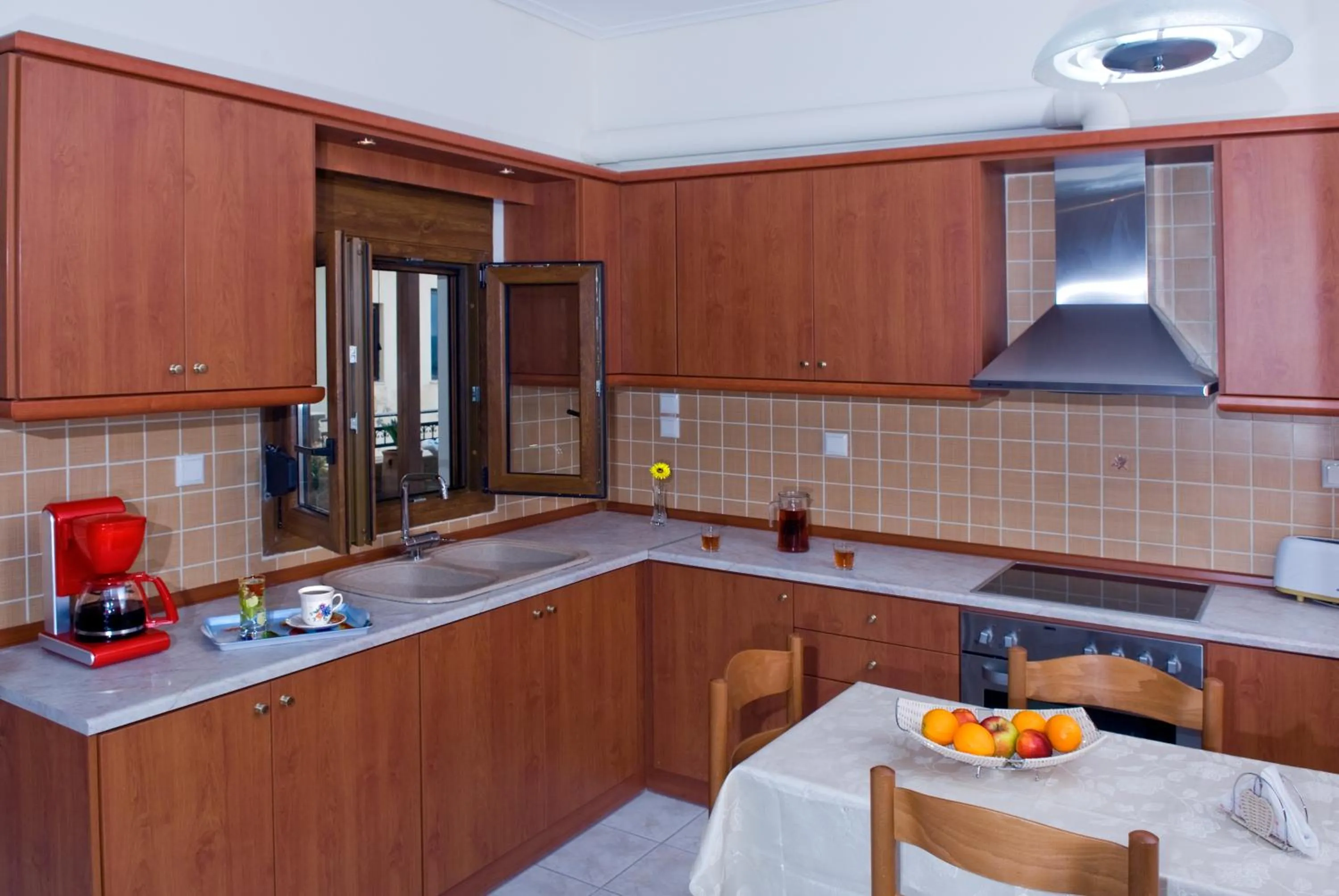 Kitchen or kitchenette in Christina Apartments