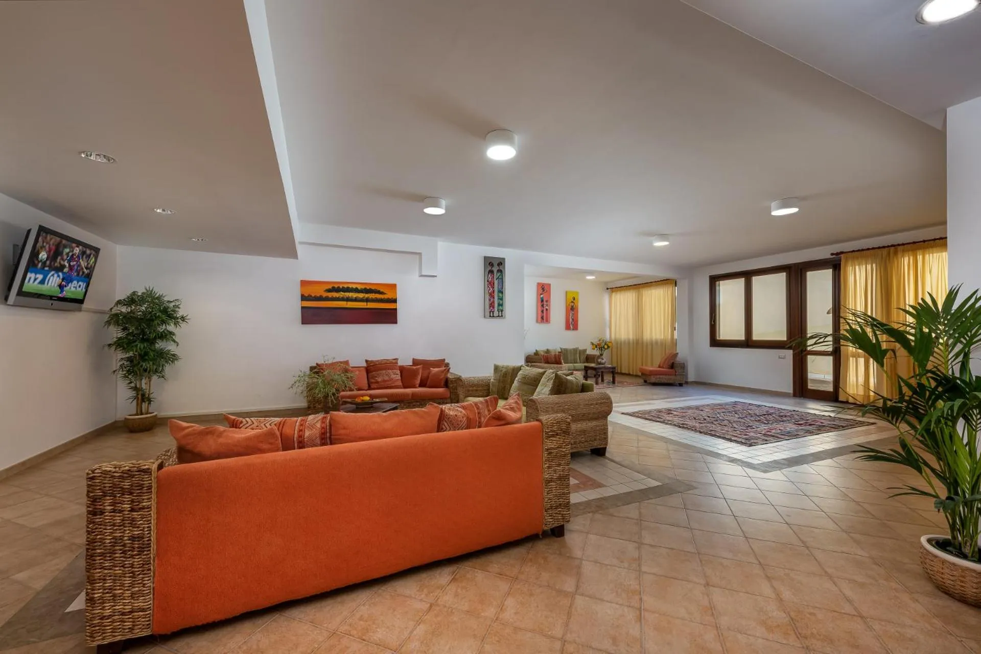 Communal lounge/ TV room in Helios Hotel