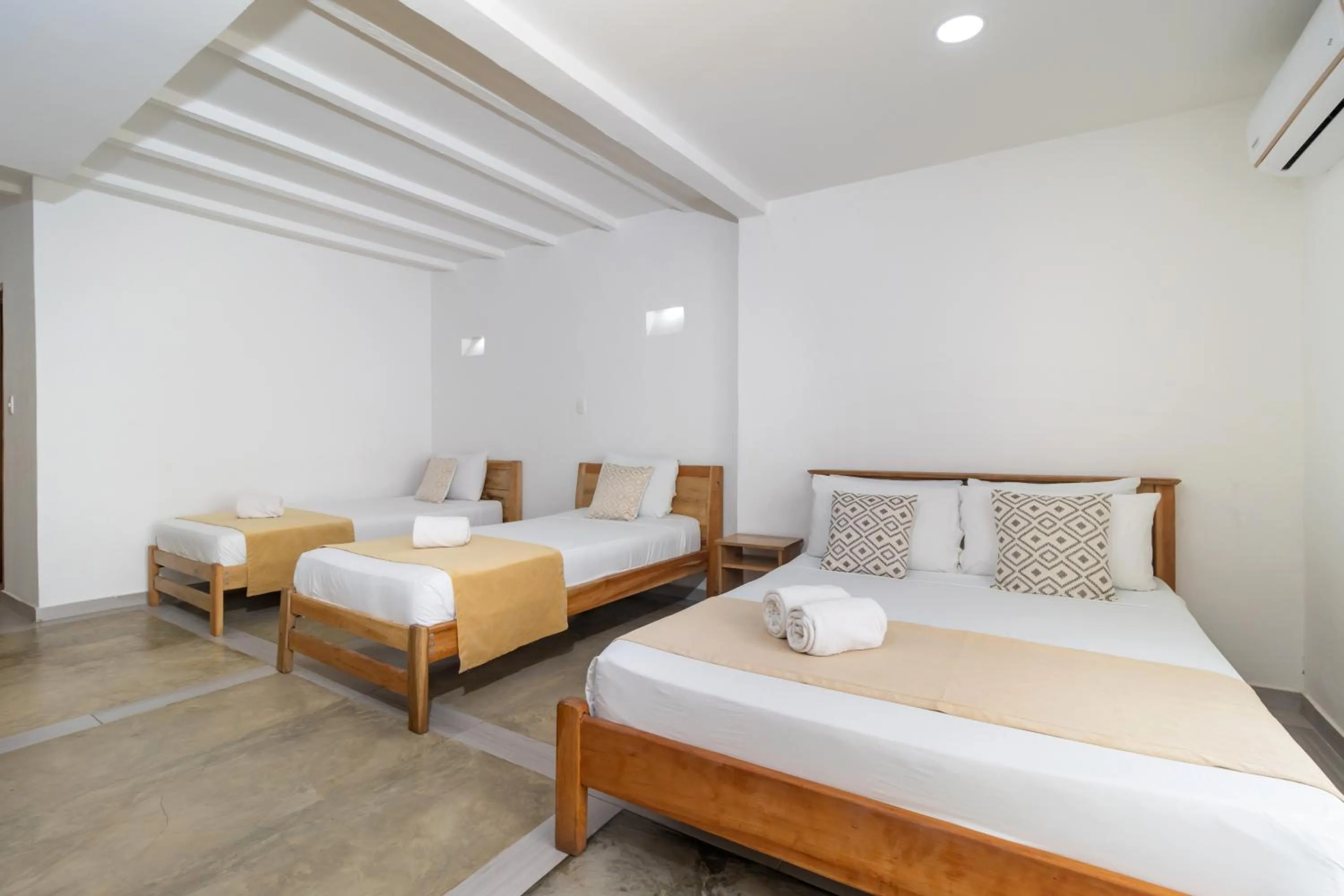 Bed in Hotel Sansiraka Suites By GEH Suites