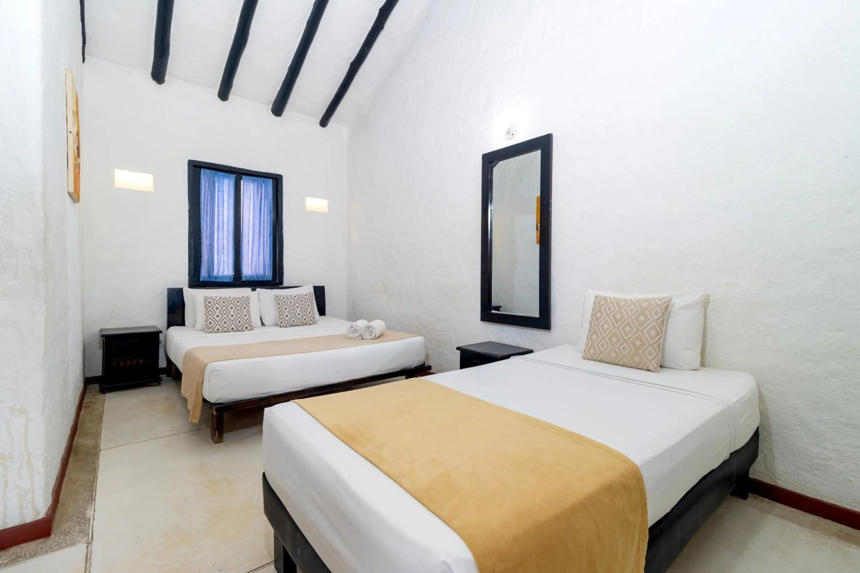 Bed in Hotel Sansiraka Suites By GEH Suites