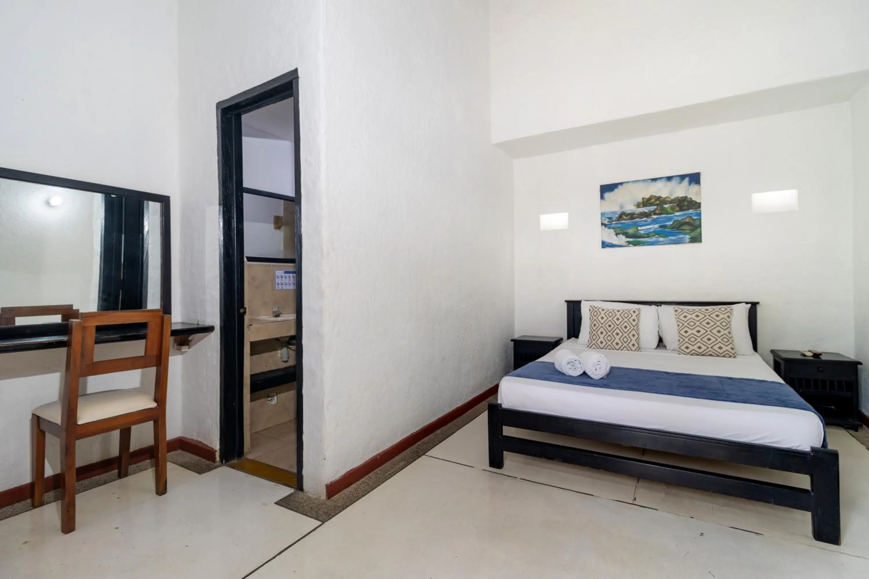 Bed in Hotel Sansiraka Suites By GEH Suites