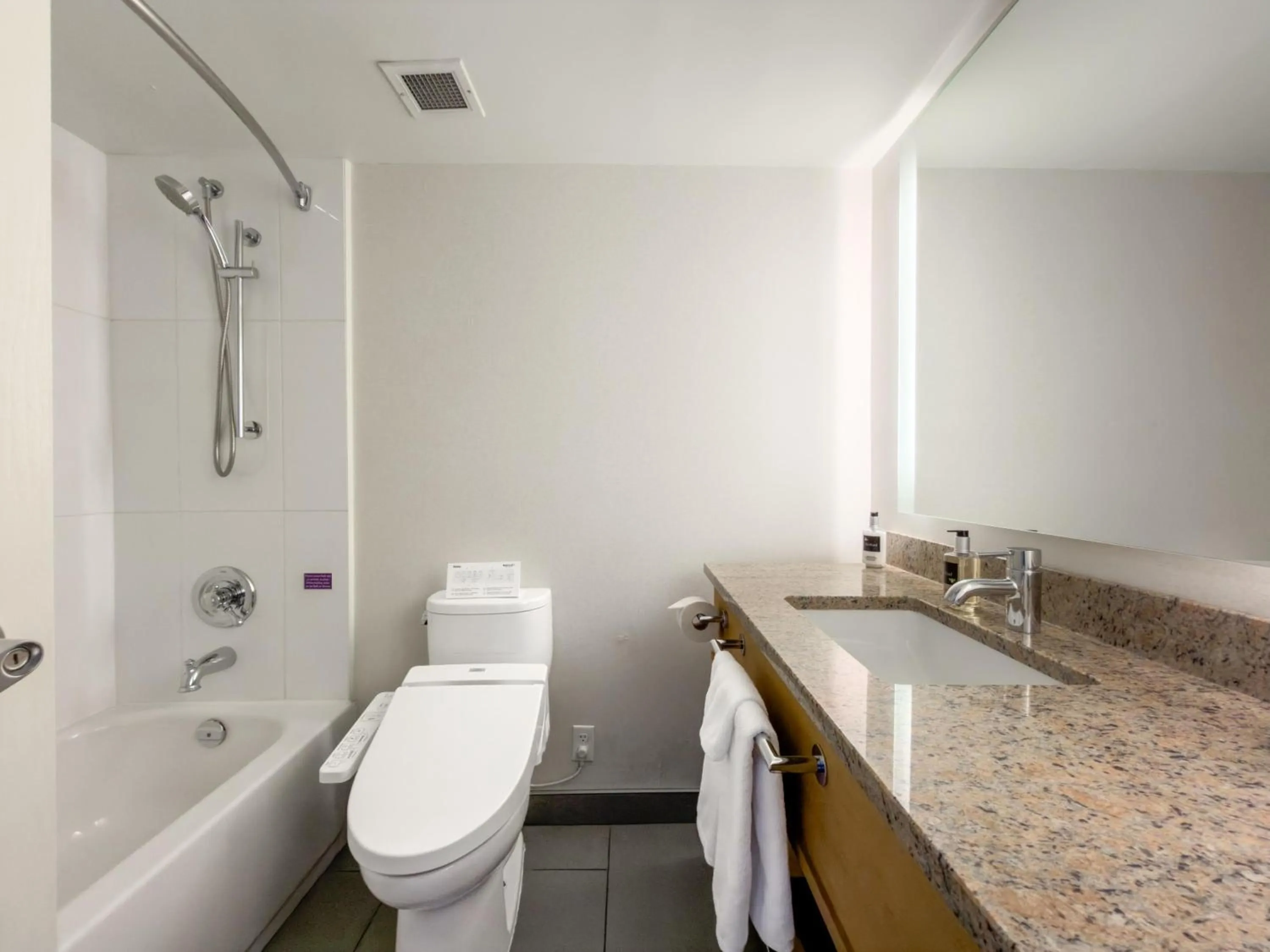 Bathroom in Coast Chilliwack Hotel by APA