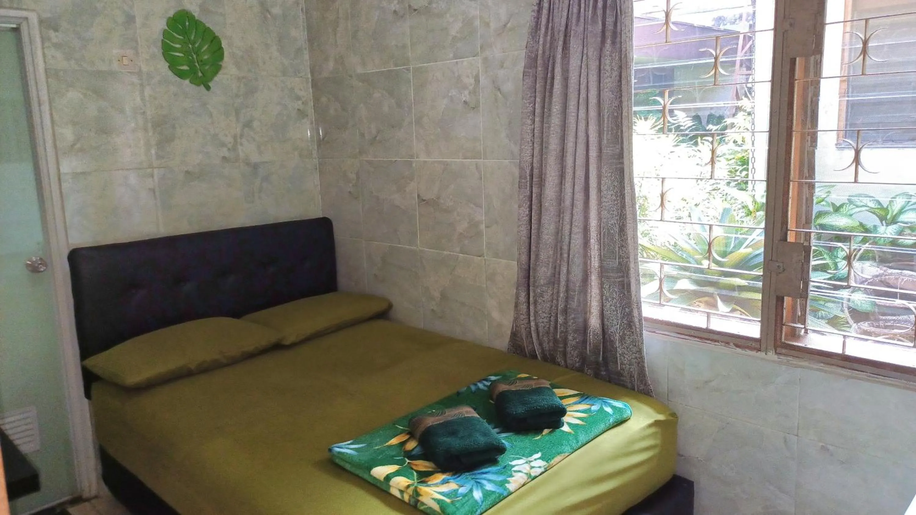 Bed in GIO Guesthouse Bogor
