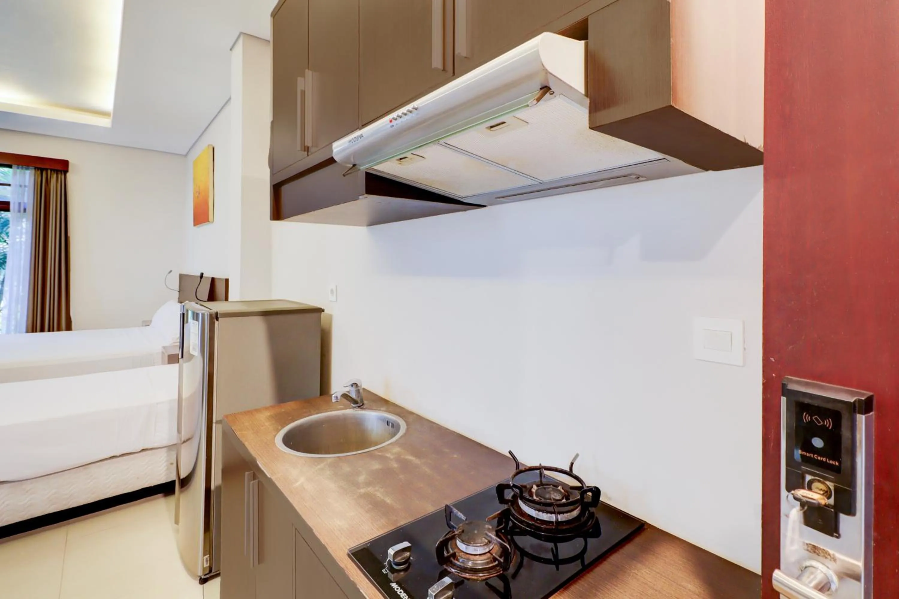 Kitchen or kitchenette, Bed in Collection O Bali near Sanur Beach formerly Akarsa Transit