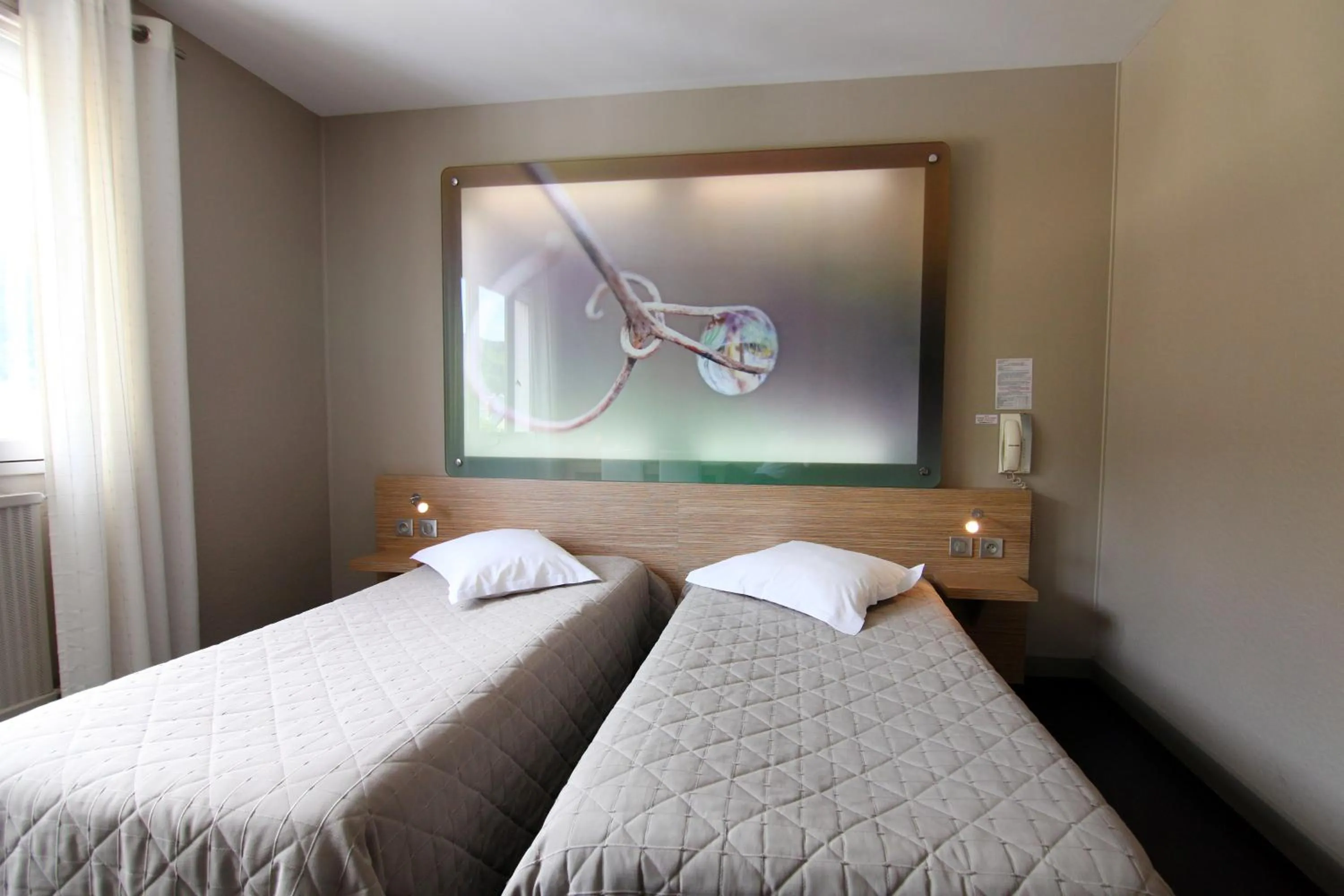 Bed in Logis Hotel Restaurant des Gorges du Tarn