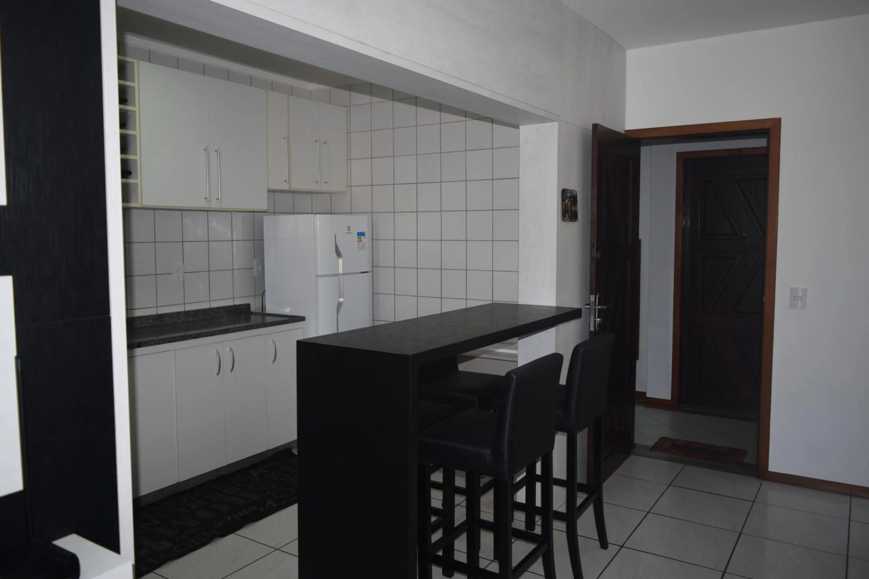 Kitchen or kitchenette in Apartamento Temporada na Praia