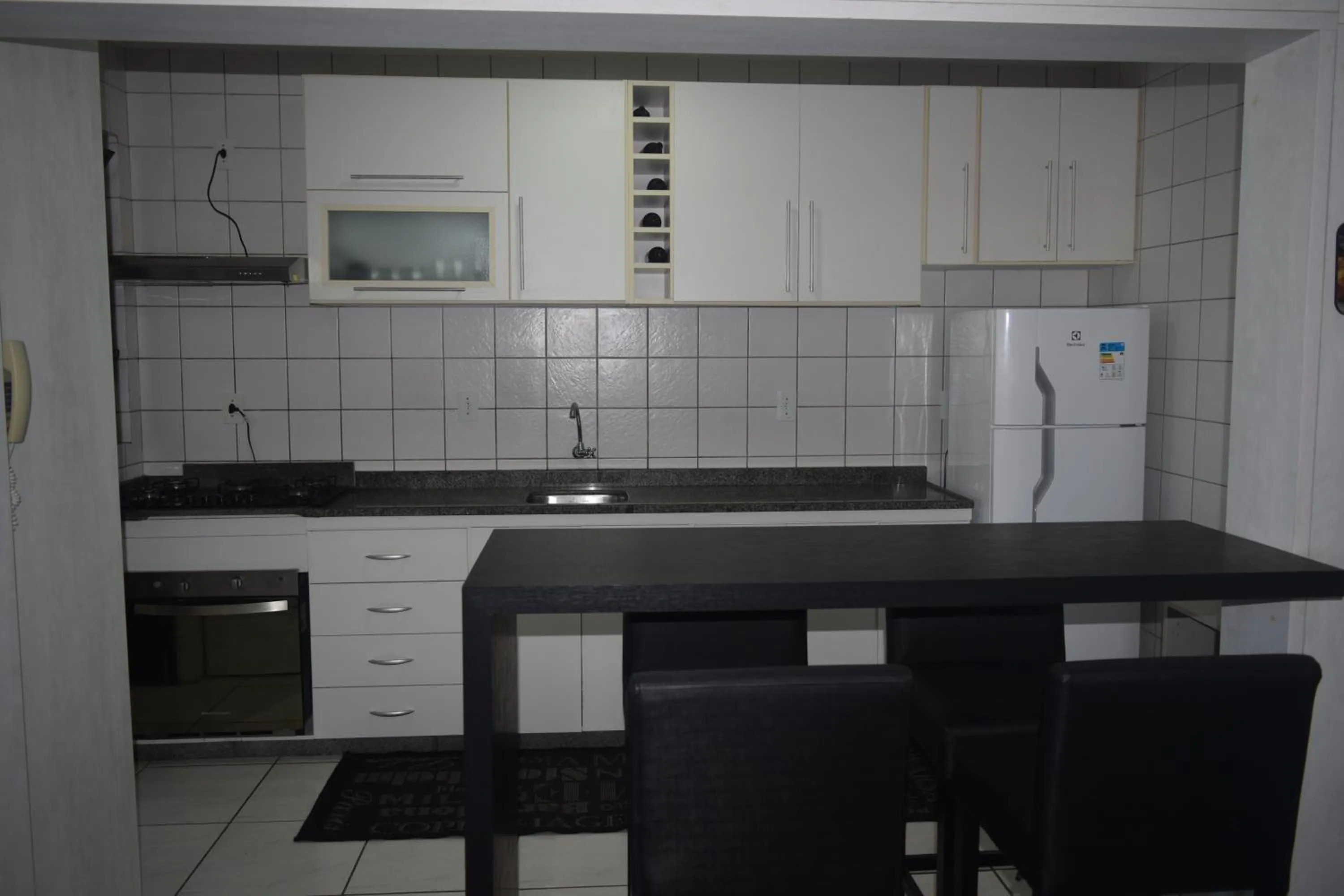 Kitchen or kitchenette in Apartamento Temporada na Praia