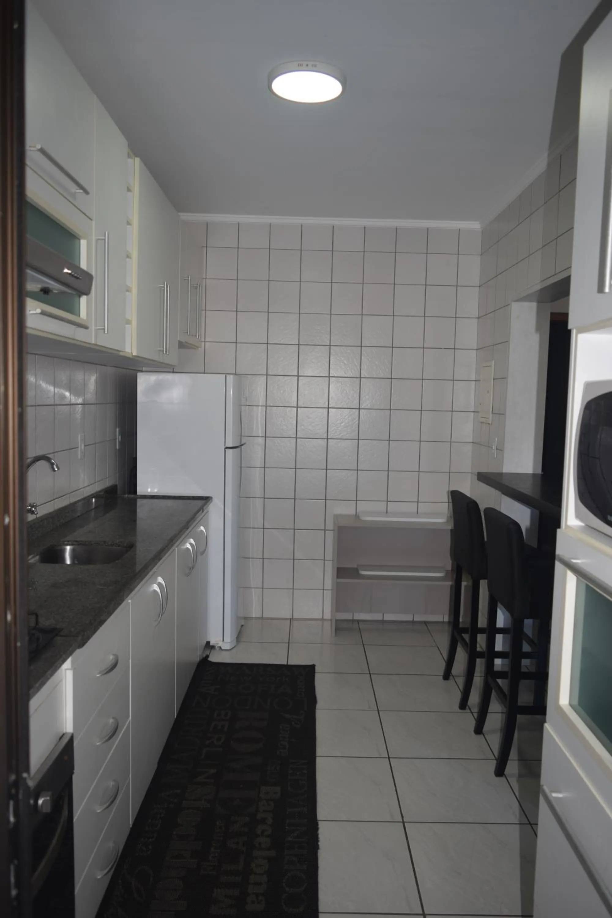 Kitchen or kitchenette in Apartamento Temporada na Praia