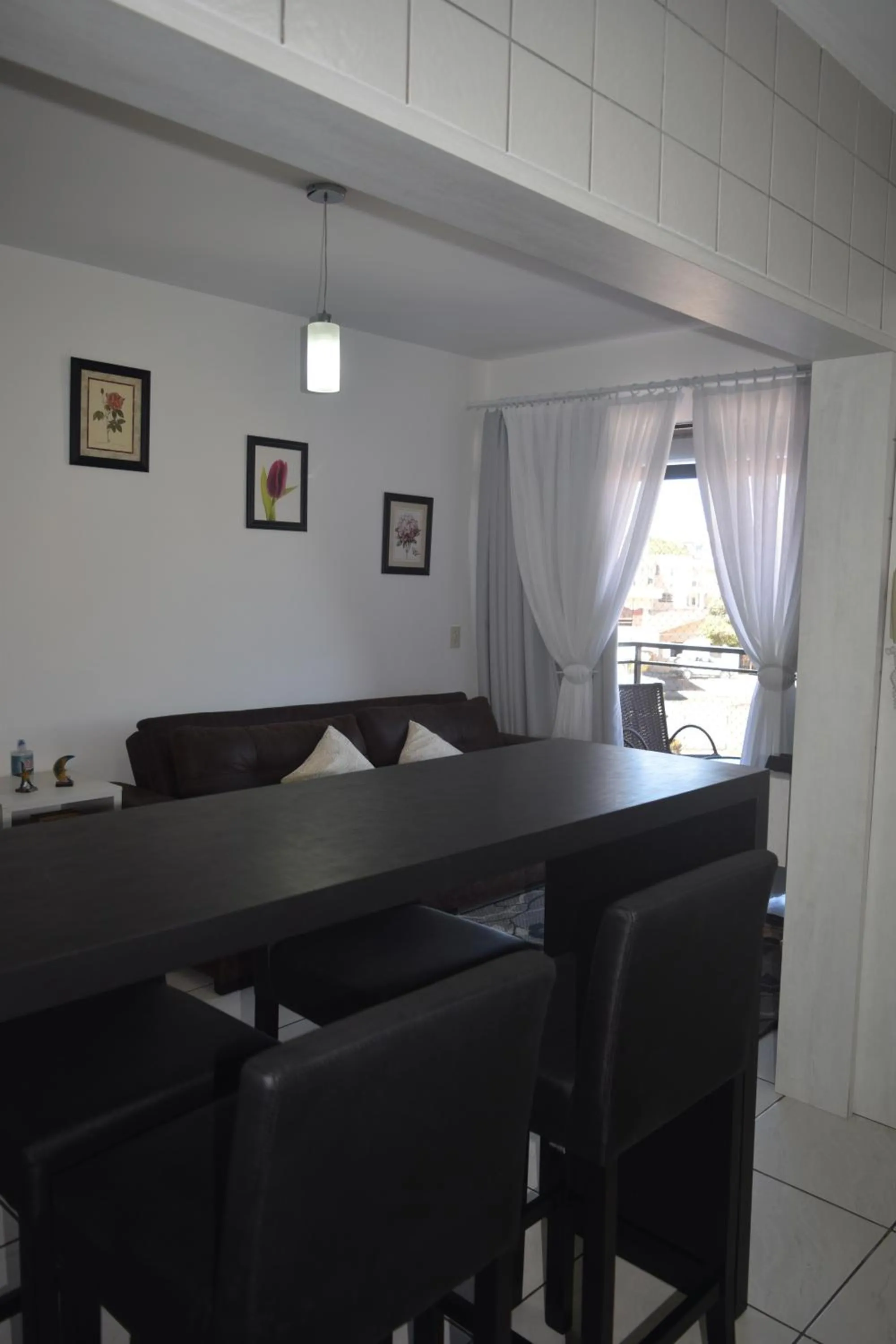 Dining area in Apartamento Temporada na Praia