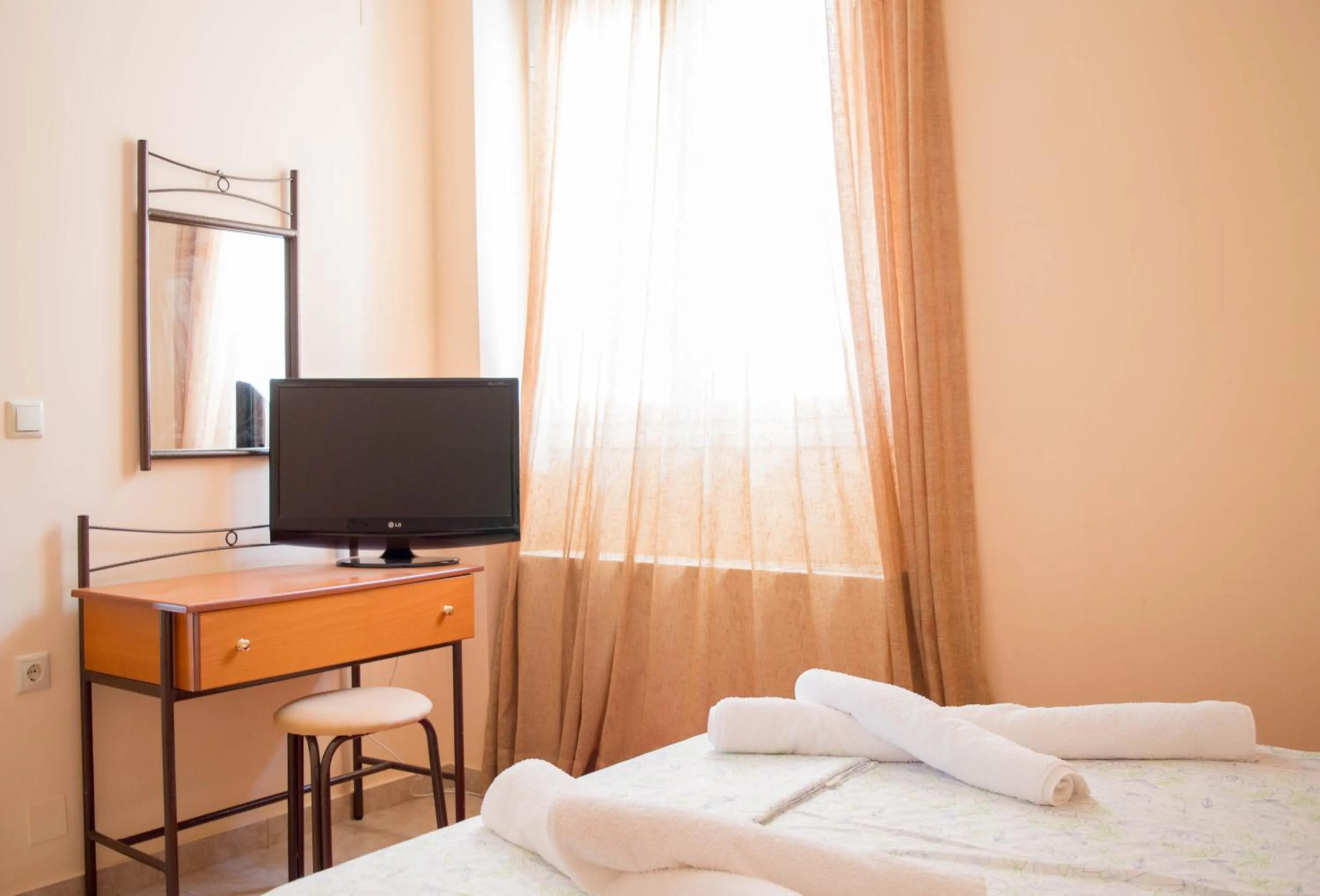 Bed in Manesi Apartments