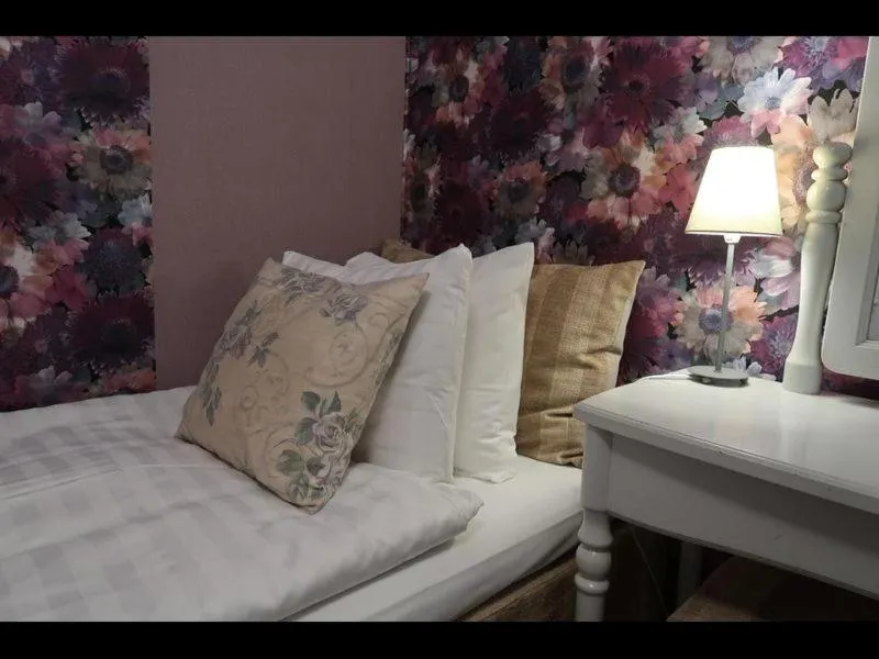 Bed in Hotel Tre Små Rum