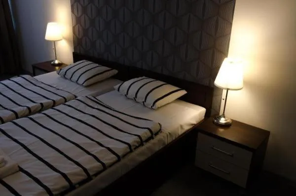 Bed in Brama Old City Rooms