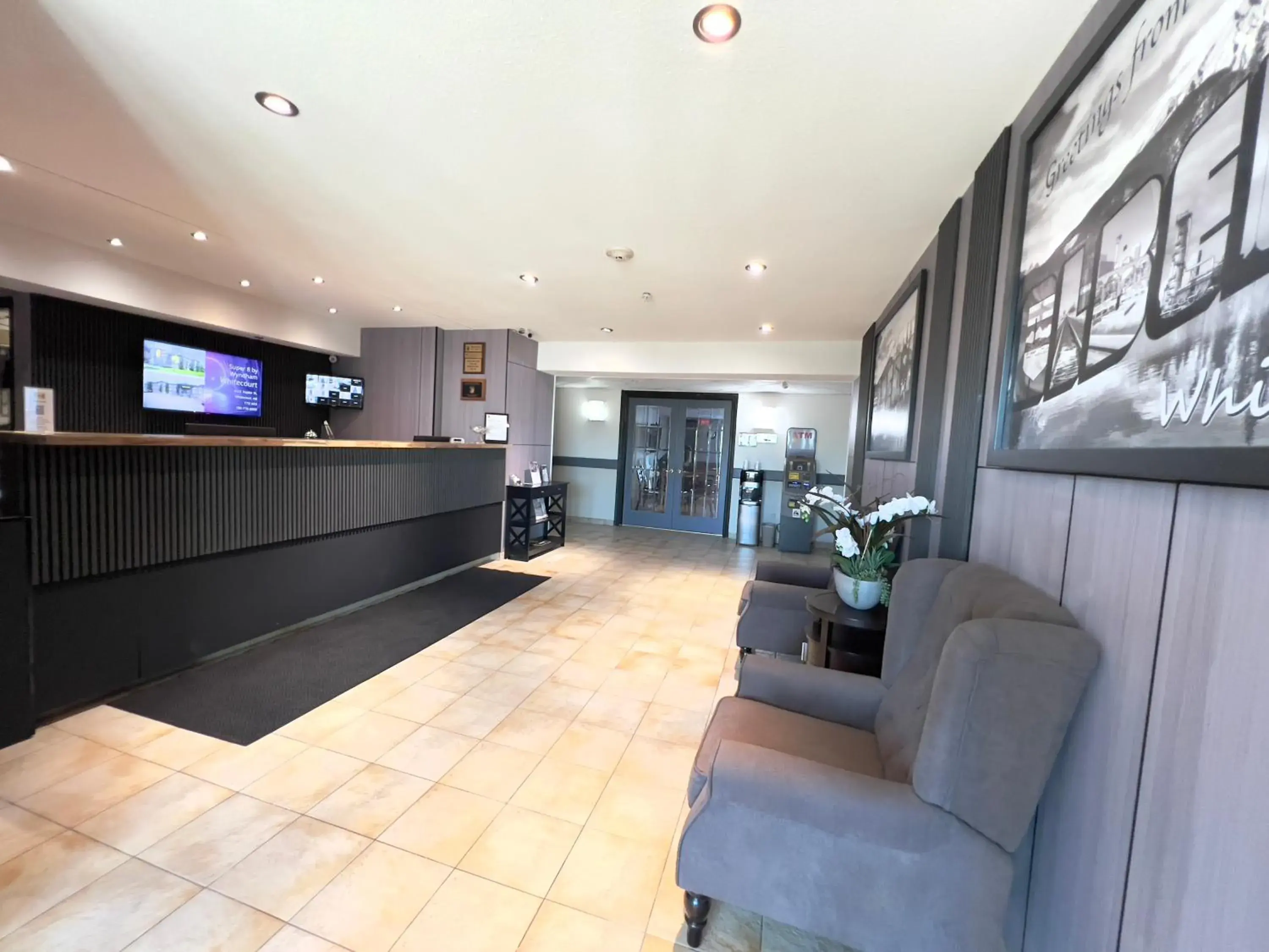 Lobby or reception in Super 8 by Wyndham Whitecourt Lobby or reception in Super 8 by Wyndham Whitecourt