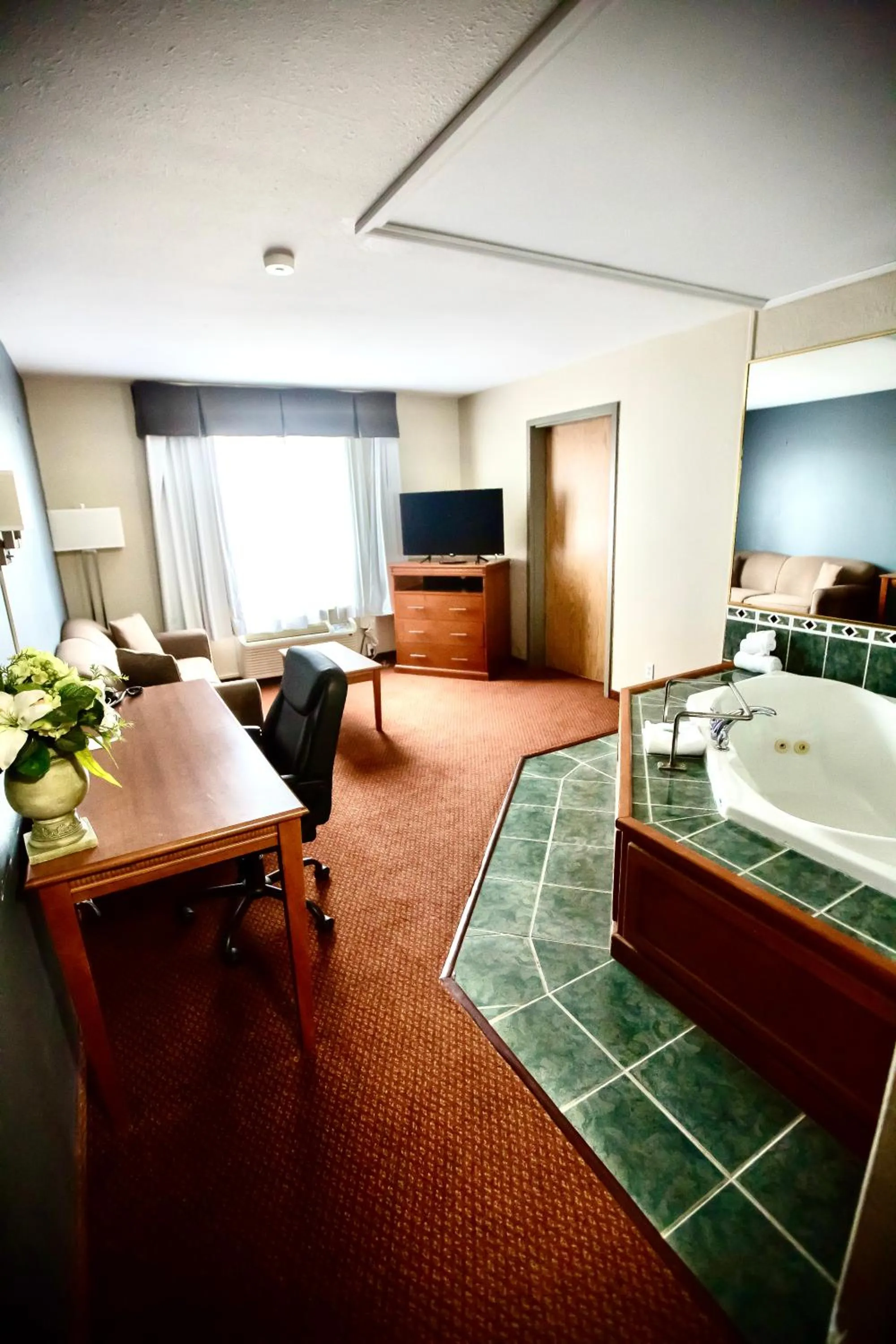 Communal lounge/ TV room, Bed in Super 8 by Wyndham Whitecourt