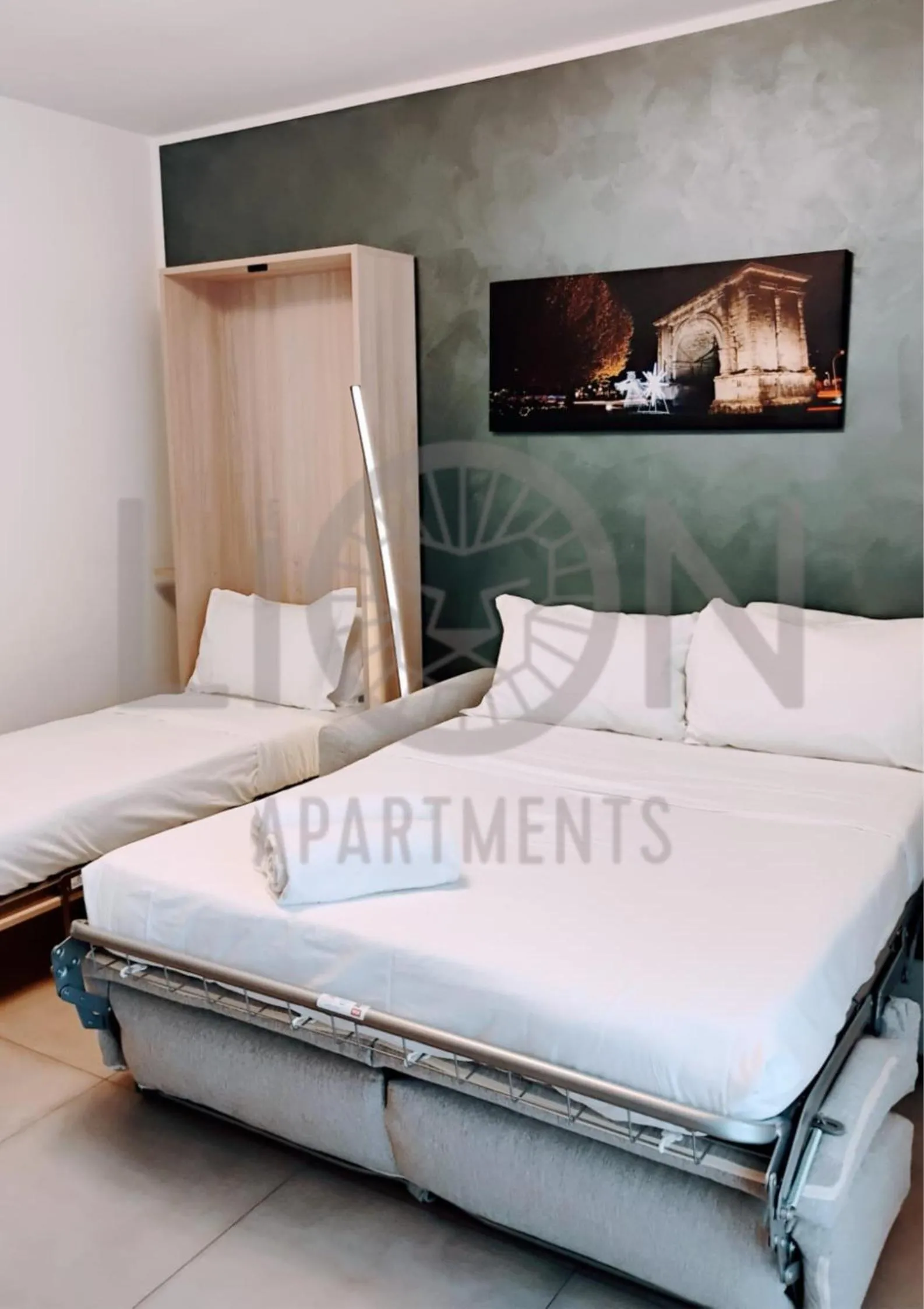 Bed in Le Lion Apartments - Lys Family Apartment