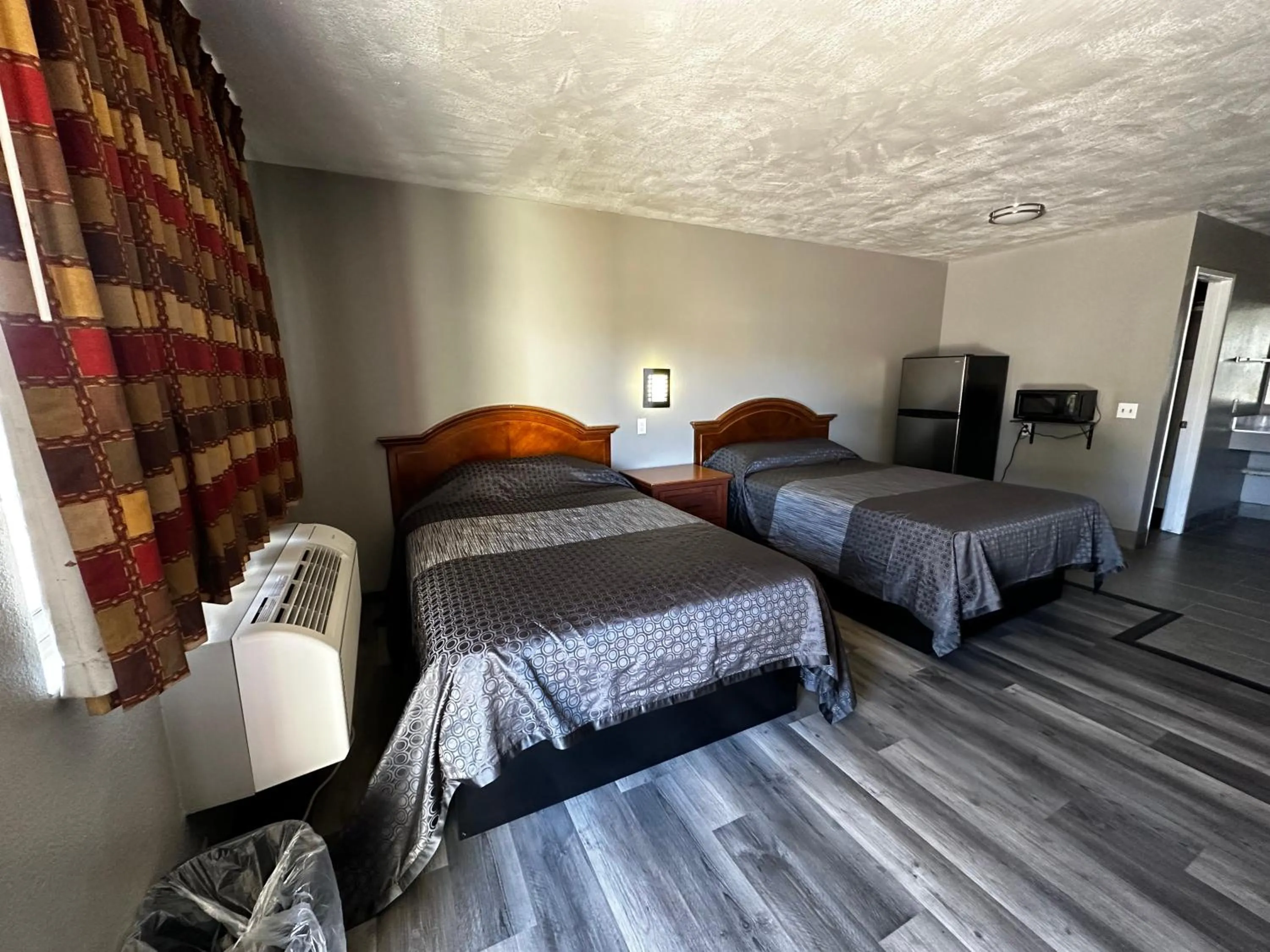 Bedroom, Bed in Sunpark Inn & Suites