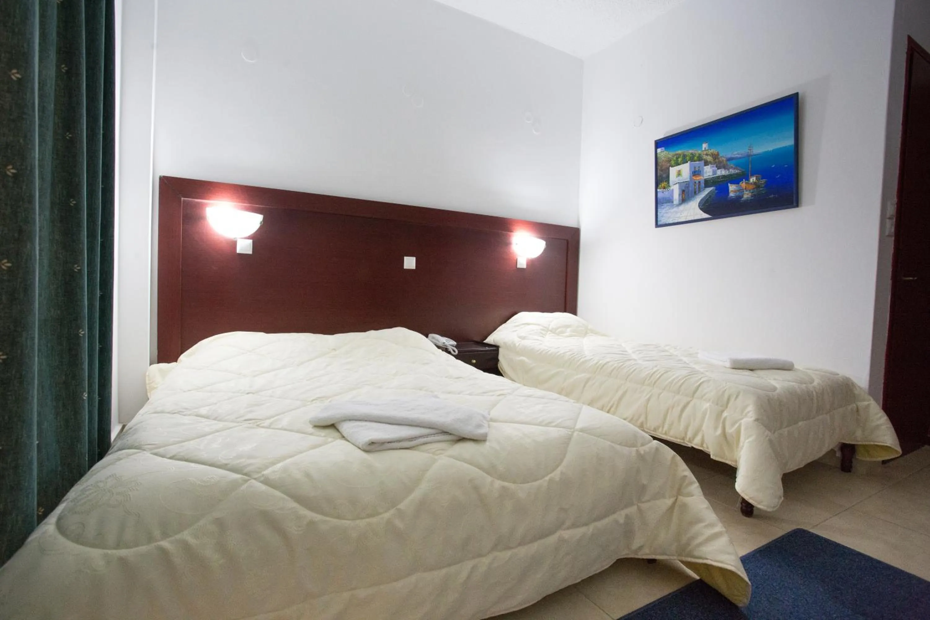 Bed in Poseidon Beach Hotel