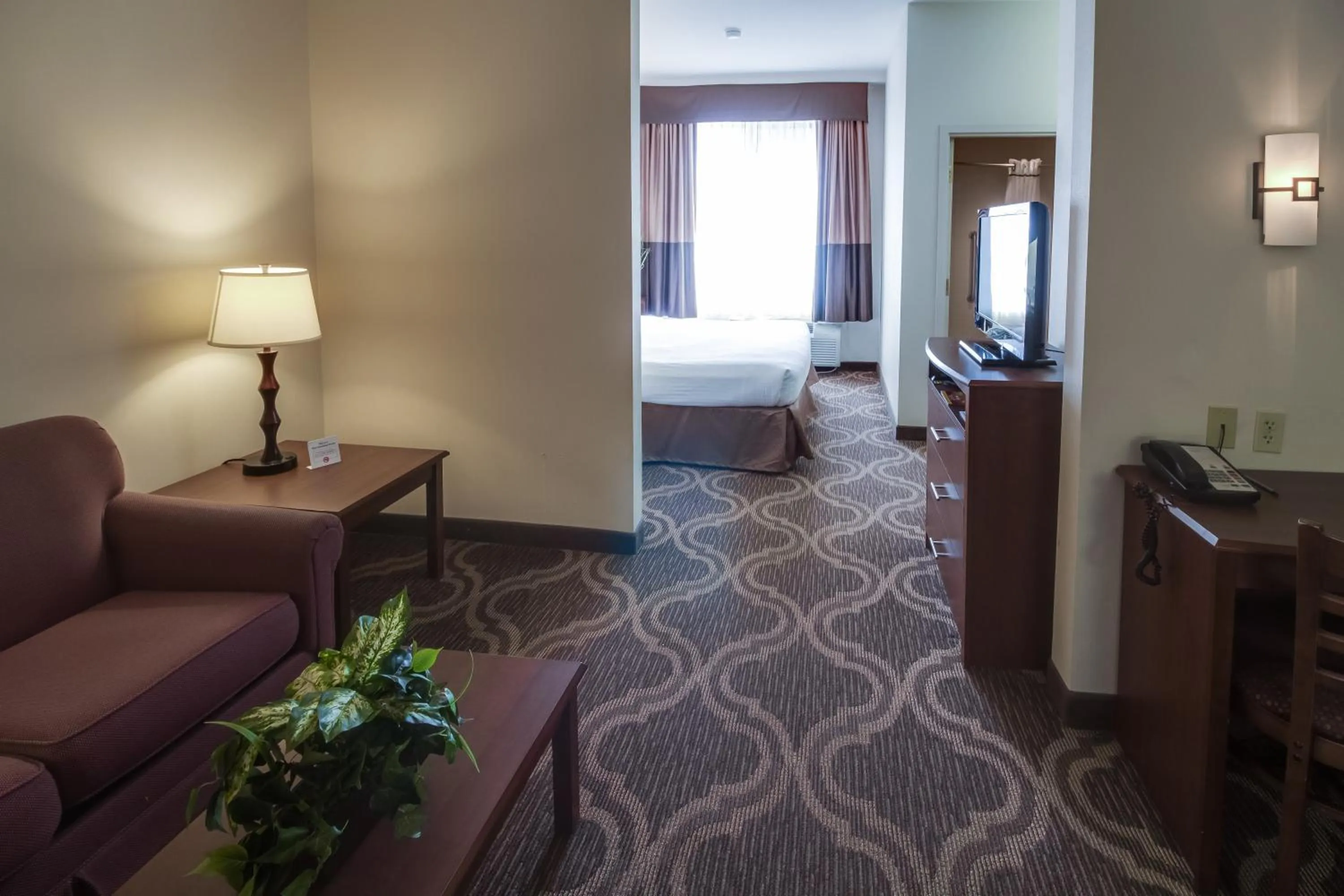 Living room, Bed in Ashmore Inn and Suites Lubbock