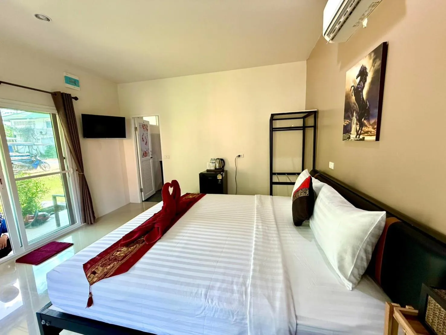 Bed in Lanta Palm Beach Resort , Beach Bungalow - Koh Lanta