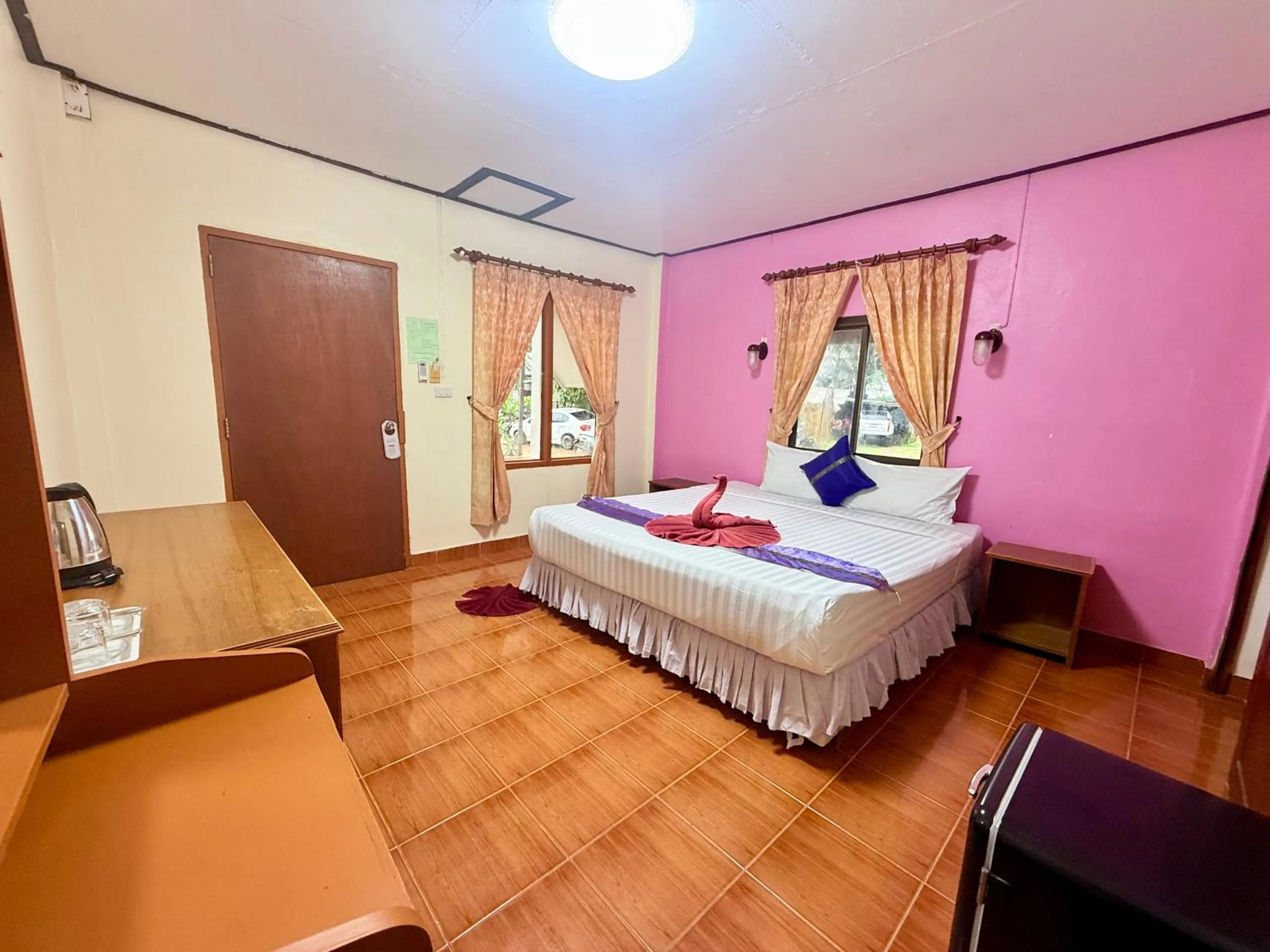 Bed in Lanta Palm Beach Resort , Beach Bungalow - Koh Lanta