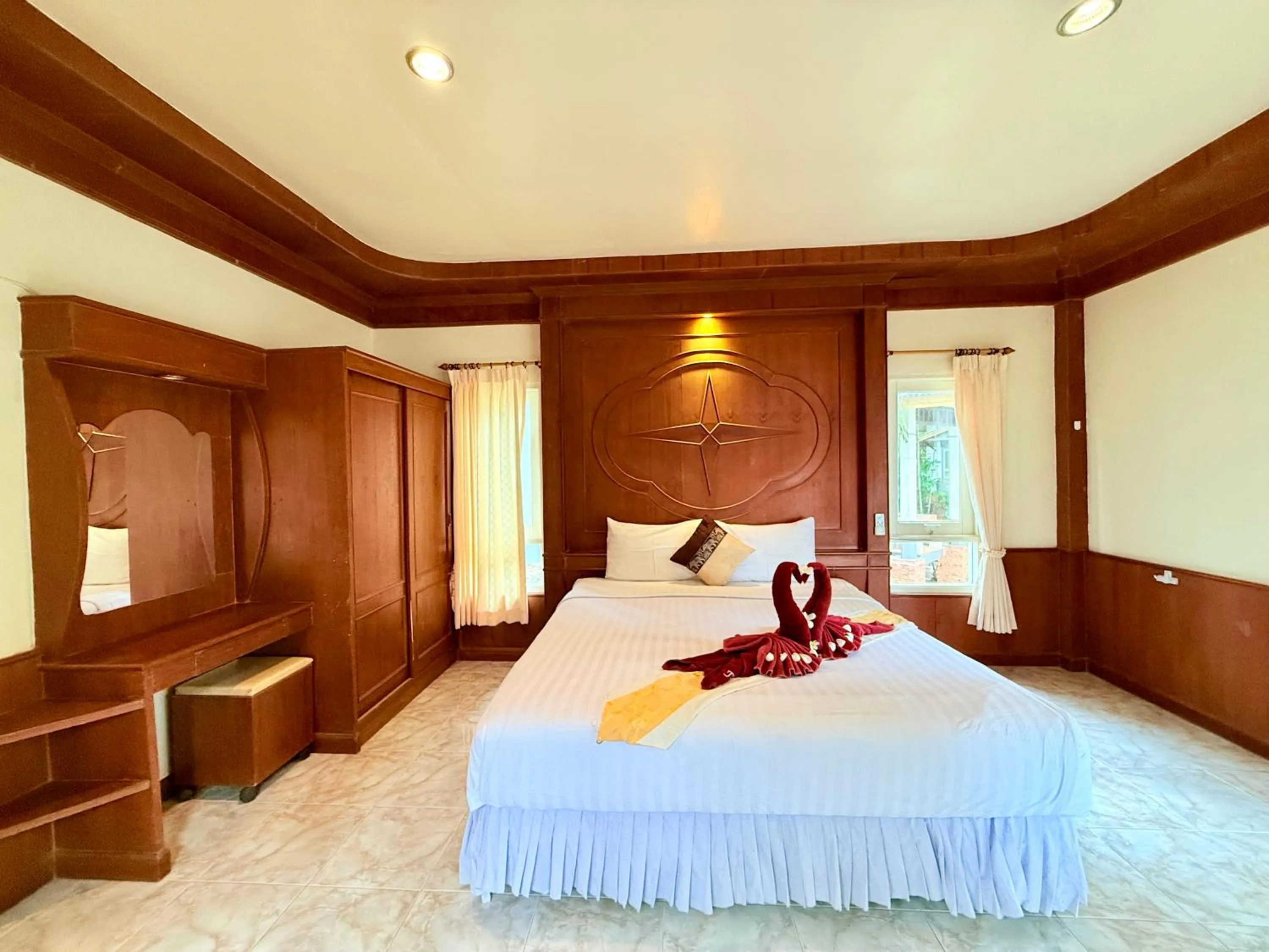 Bed in Lanta Palm Beach Resort , Beach Bungalow - Koh Lanta