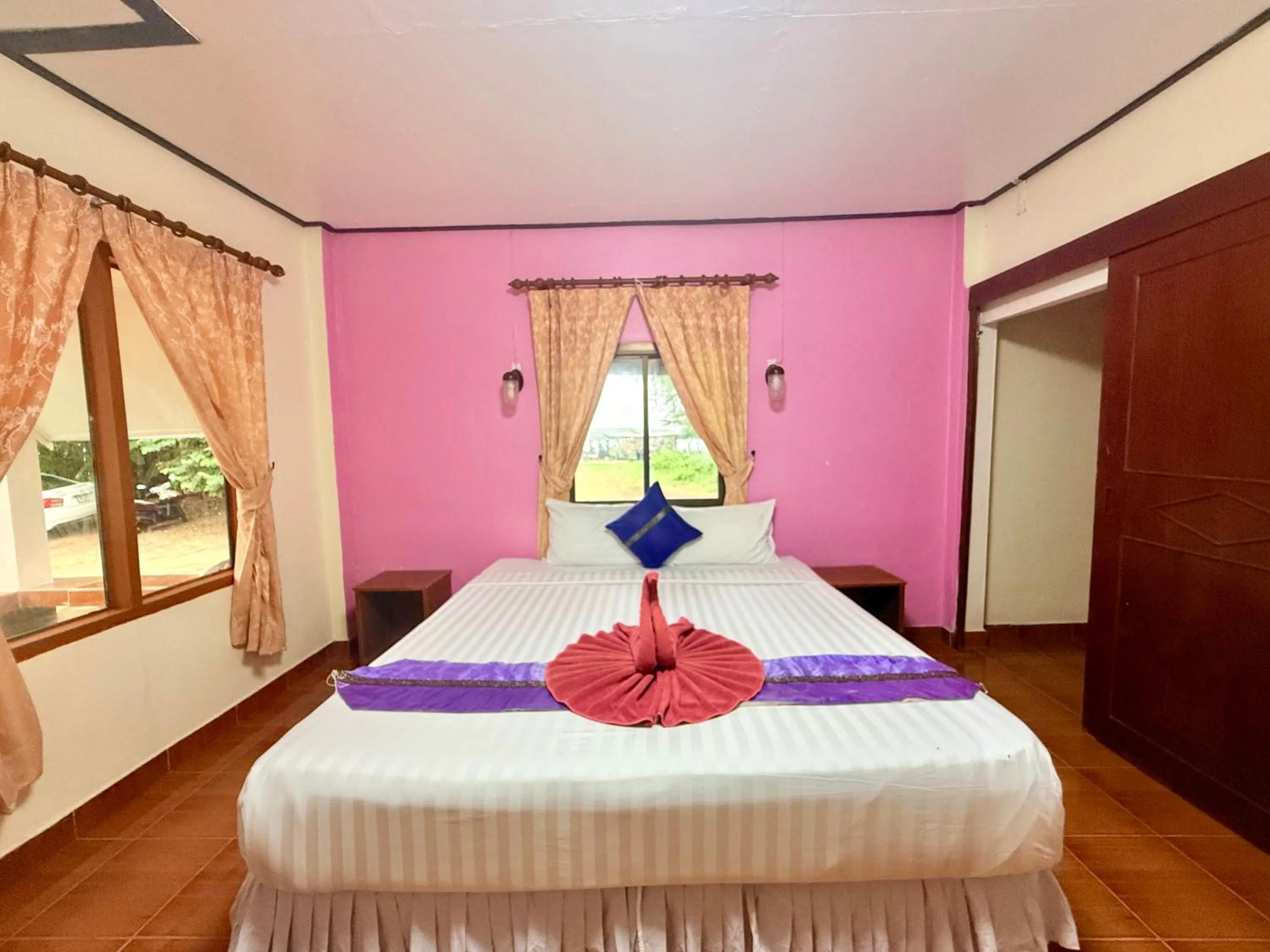 Bed in Lanta Palm Beach Resort , Beach Bungalow - Koh Lanta