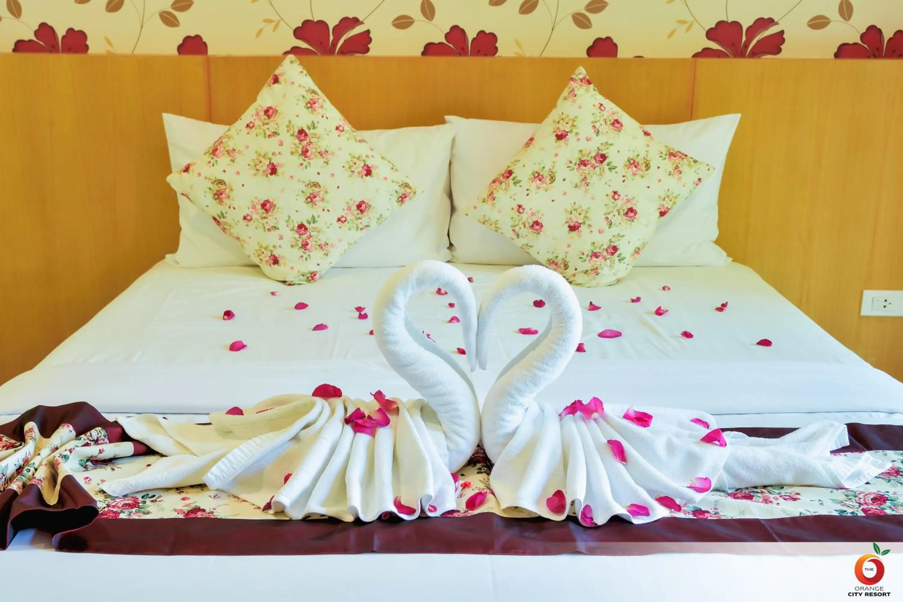 Bed in The Orange City Resort