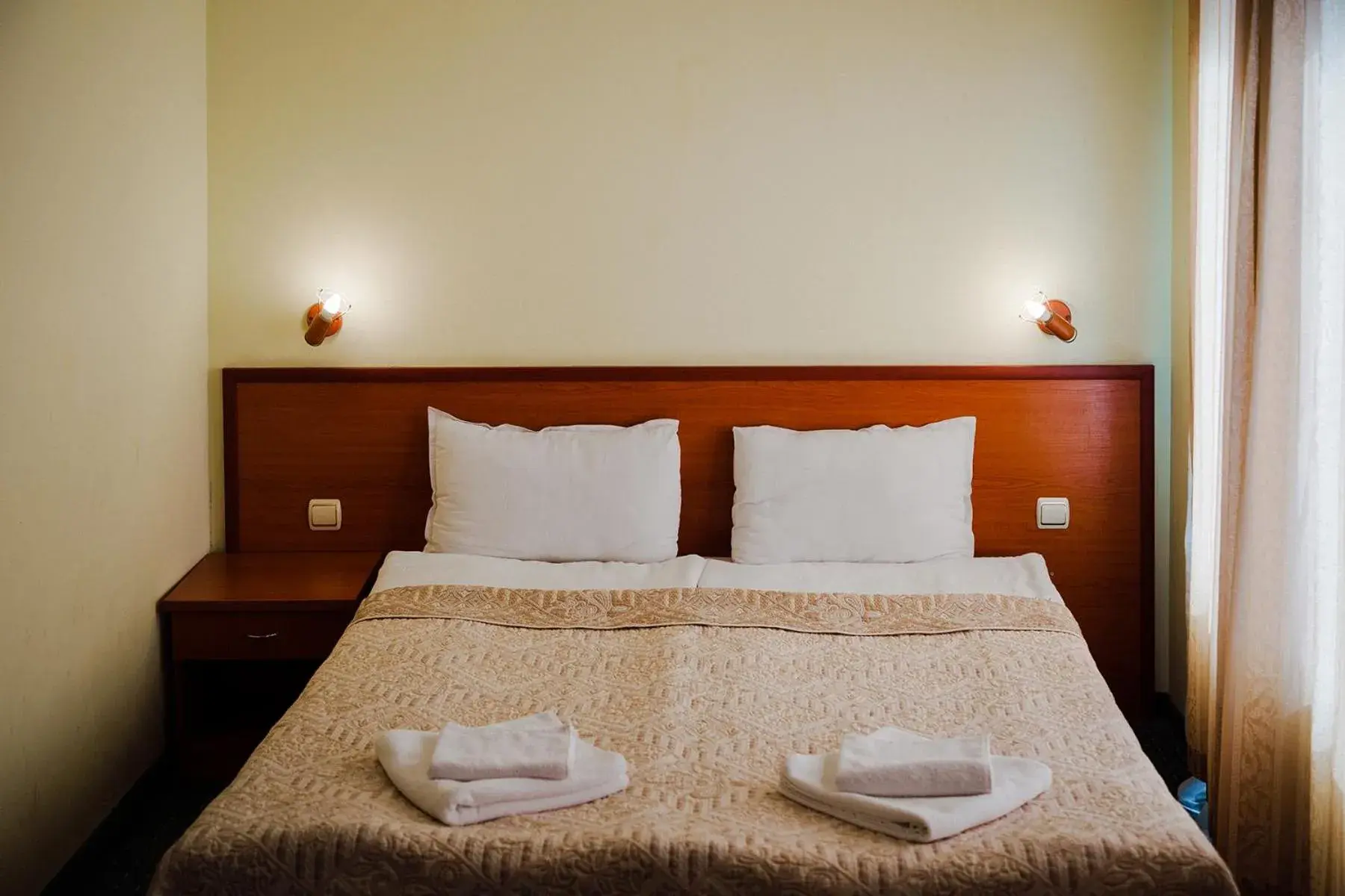 Bed in Dionis Hotel Bed in Dionis Hotel