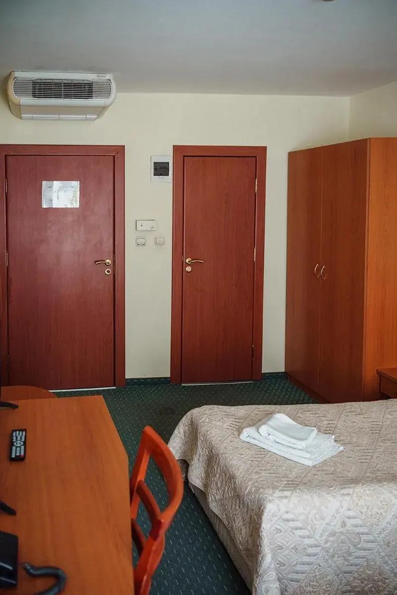 Bed in Dionis Hotel Bed in Dionis Hotel